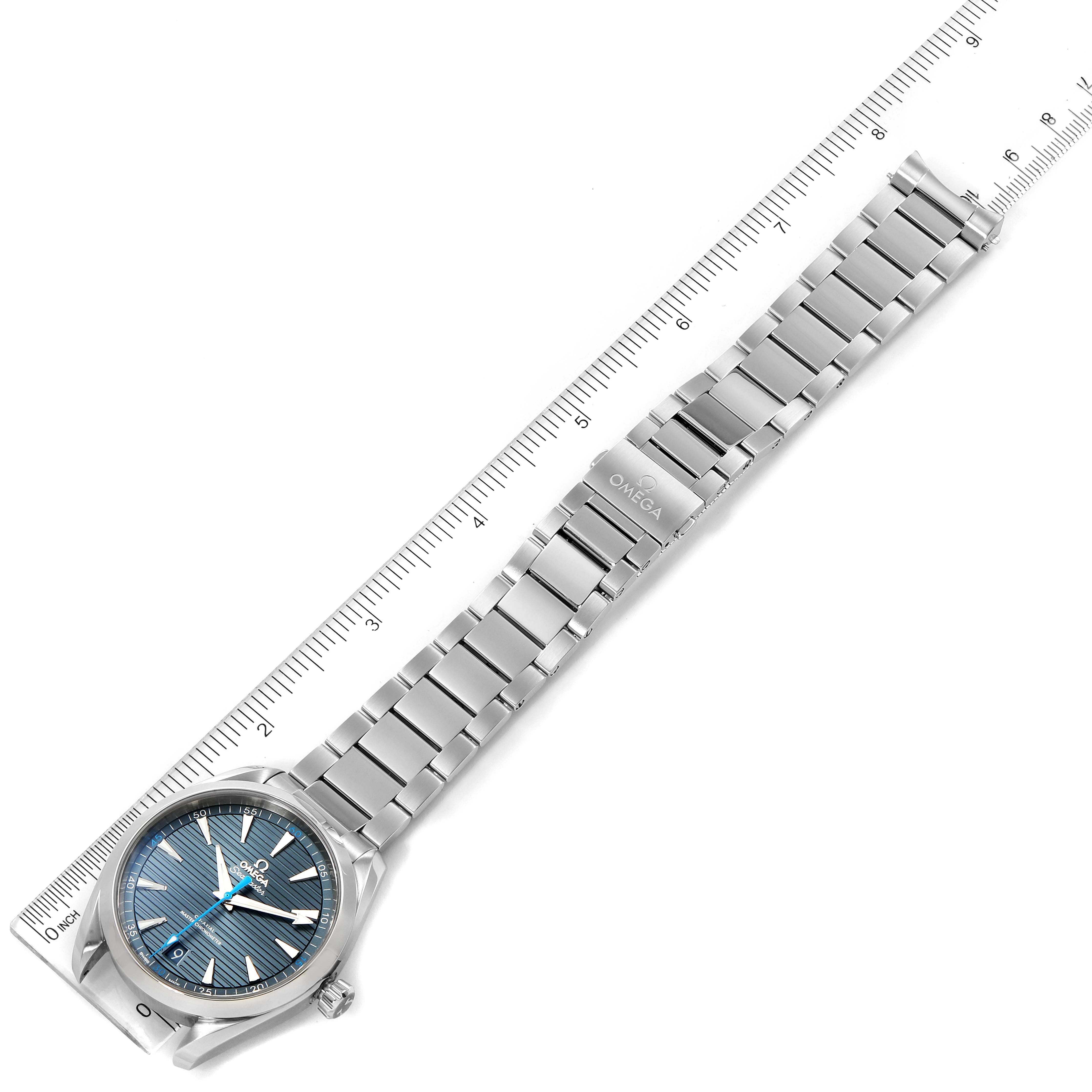 The Omega Aqua Terra 220.10.41.21.03.002 Men
s Stainless Steel Blue Dial 220.10.41.21.03.002 Men
s Stainless Steel Blue Dial watch is shown at a top-down angle, featuring the full bracelet and dial next to a ruler for scale.