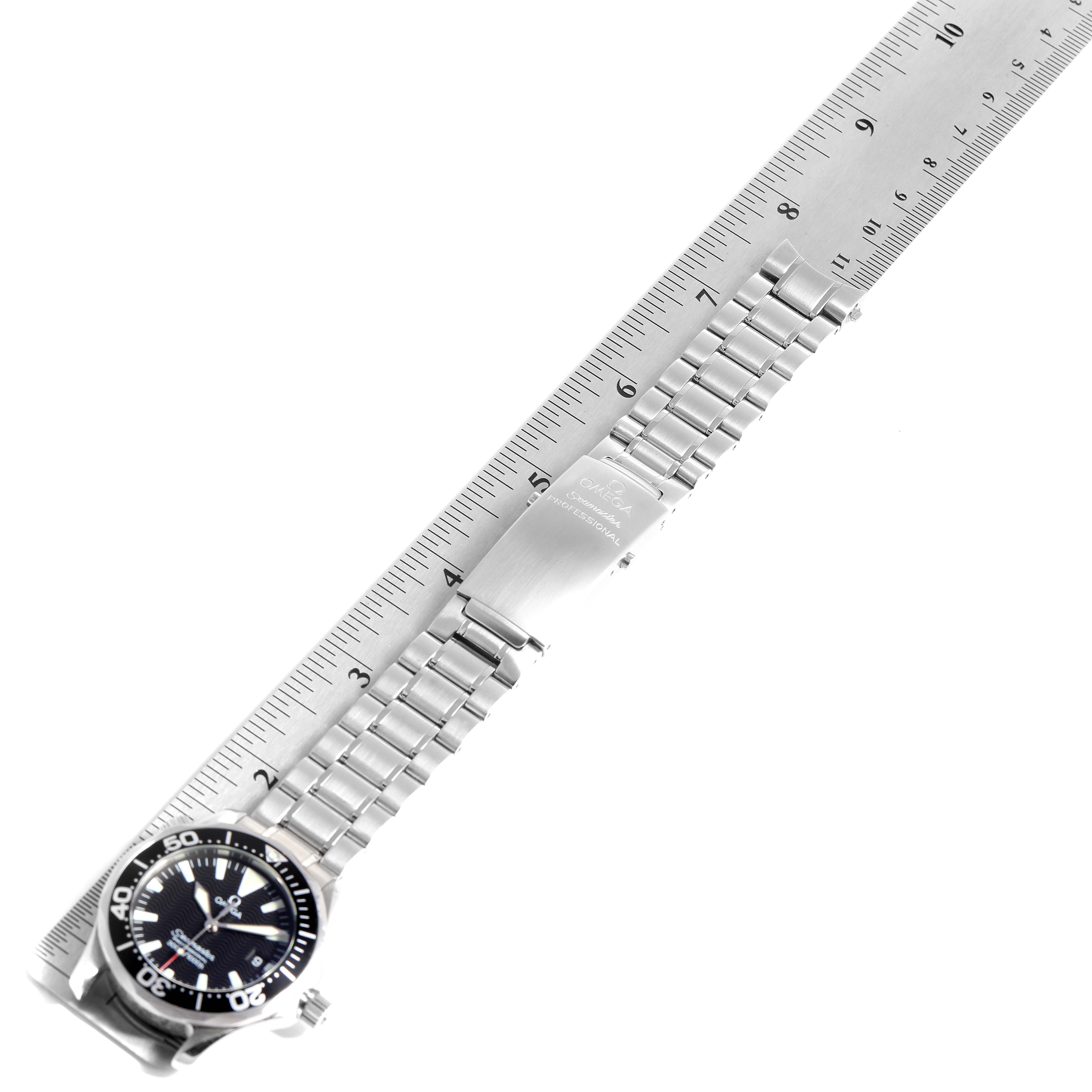 The image displays an Omega Seamaster 2564.50.00 Men
s Stainless Steel Black Dial 2564.50.00 Men
s Stainless Steel Black Dial watch with a stainless steel bracelet, shown alongside a ruler for scale.