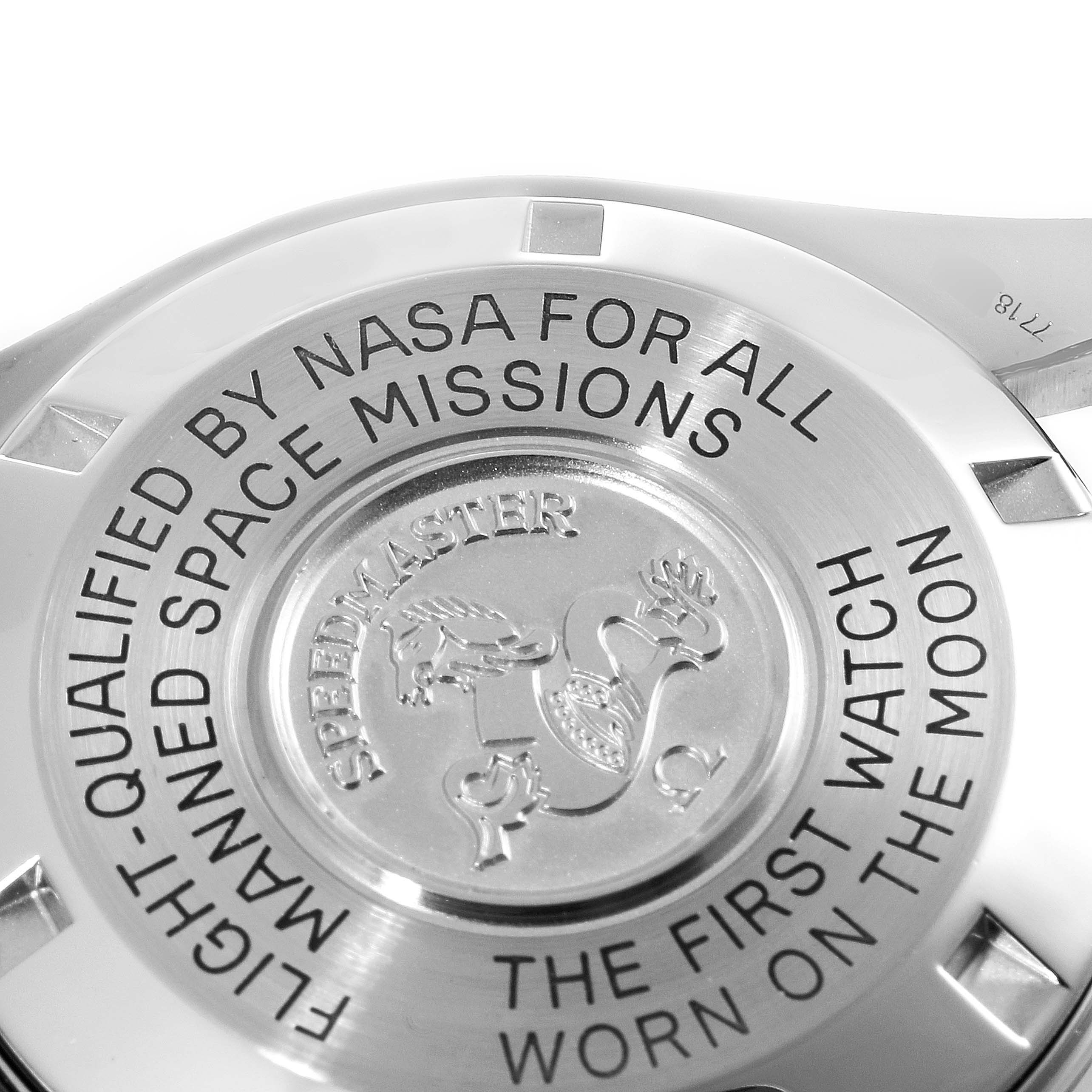 The image shows the case back of the Omega Speedmaster 3570.50.00 Men
s Stainless Steel Black Dial 3570.50.00 Men
s Stainless Steel Black Dial watch, highlighting NASA qualifications and lunar mission details.