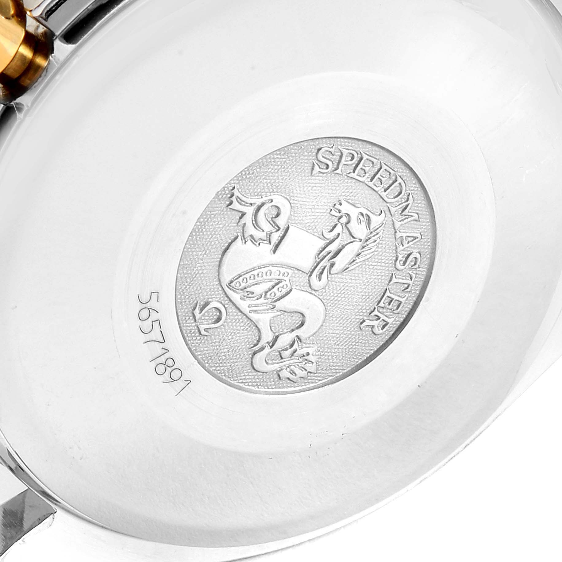 The image shows the back case of an Omega Speedmaster 3313.50.00 Men
s Steel and Gold (two tone) Black Dial 3313.50.00 Men
s Steel and Gold (two tone) Black Dial watch, highlighting its engraved emblem and model number.