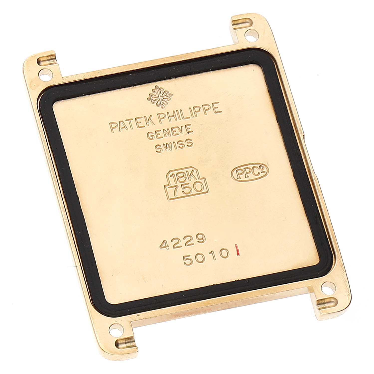 This image shows the back case of a Patek Philippe Gondolo 5010J Men's Yellow Gold Silver Dial 5010J Men's Yellow Gold Silver Dial watch, positioned at a slightly turned angle.