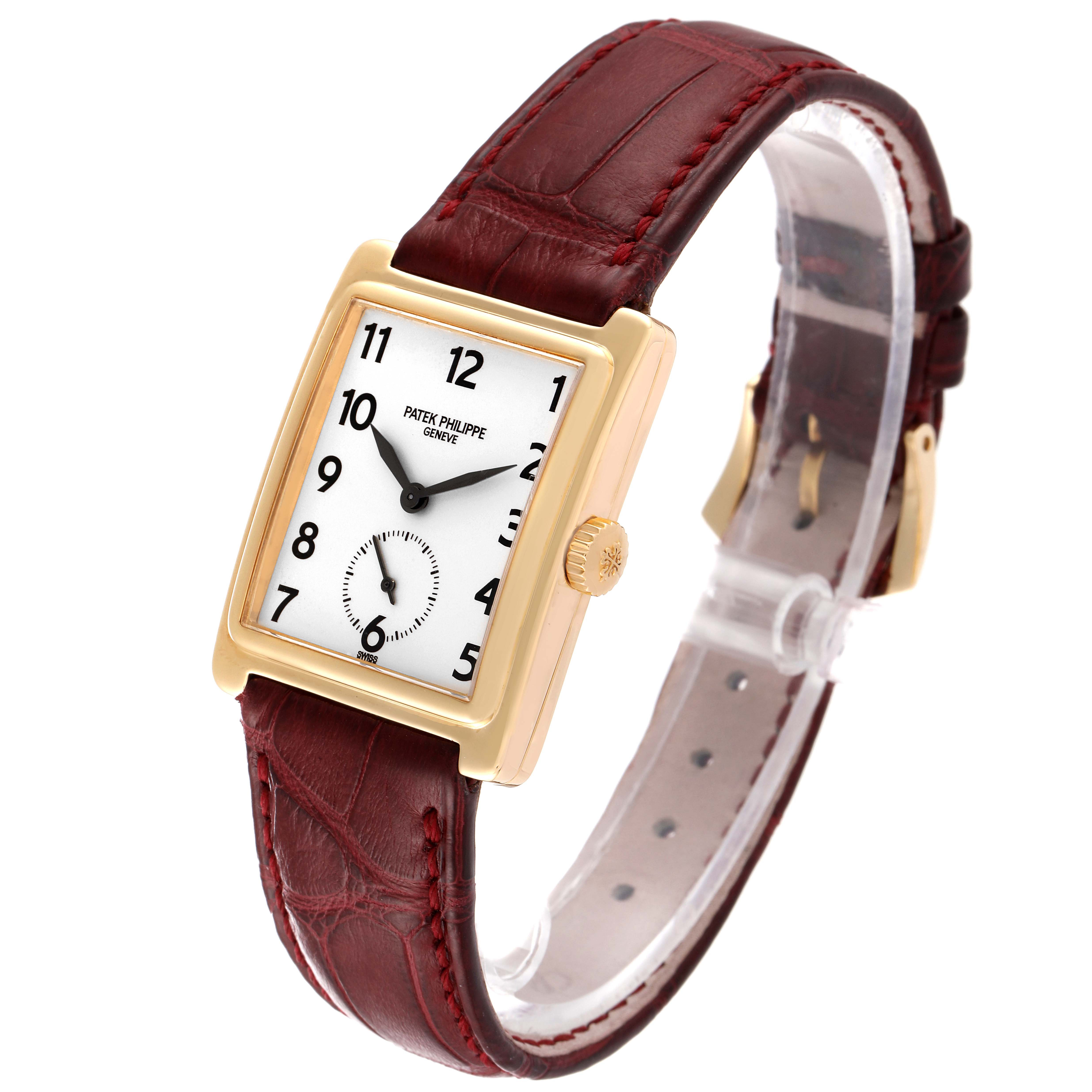 The Patek Philippe Gondolo 5010J Men's Yellow Gold Silver Dial 5010J Men's Yellow Gold Silver Dial watch is shown at a three-quarter angle, highlighting its rectangular dial, gold case, and maroon leather strap.
