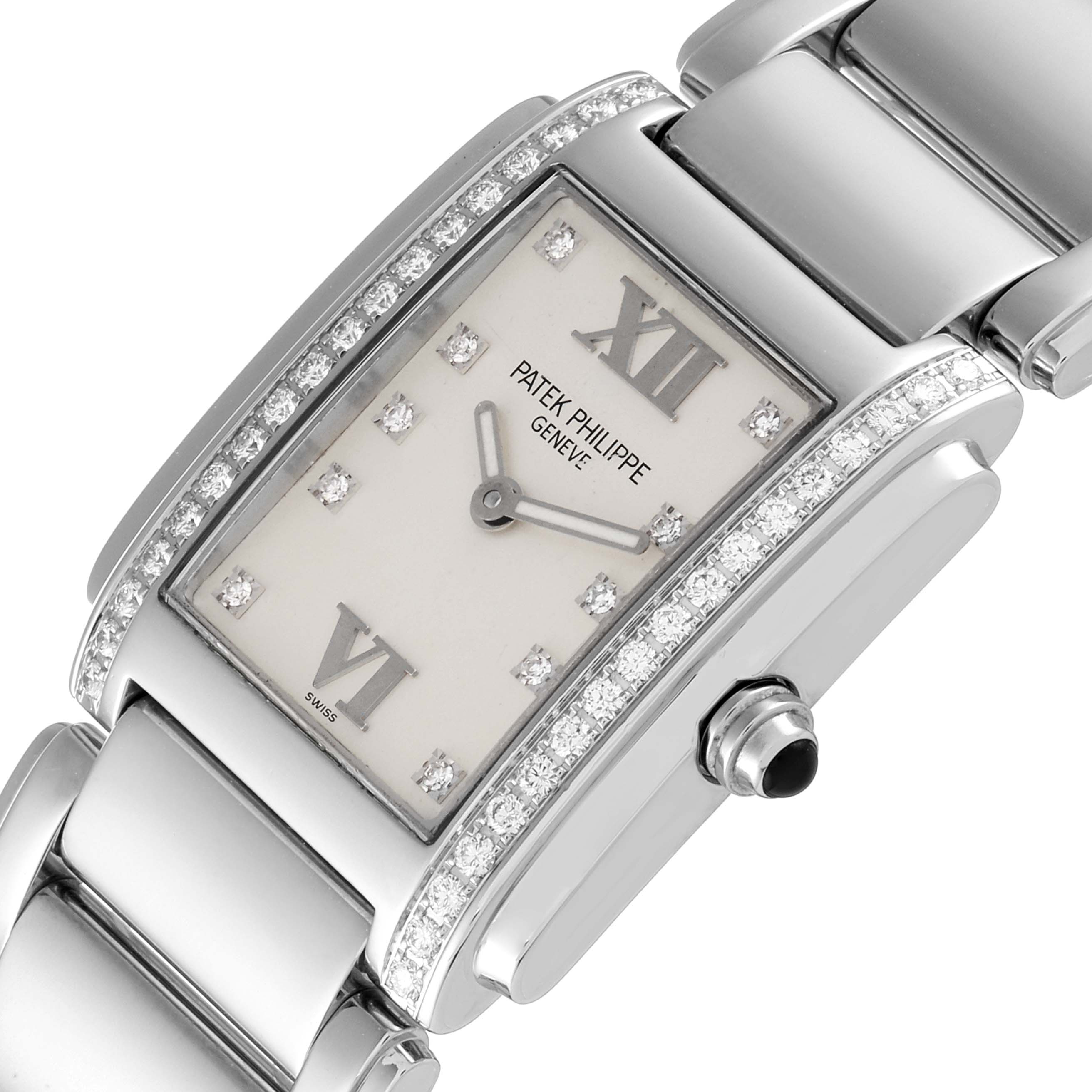The image shows a close-up of the Patek Philippe Twenty-4 4910/10A-010 Women's Stainless Steel Silver Dial 4910/10A-010 Women's Stainless Steel Silver Dial watch face, crown, and bracelet, highlighting the diamond accents.