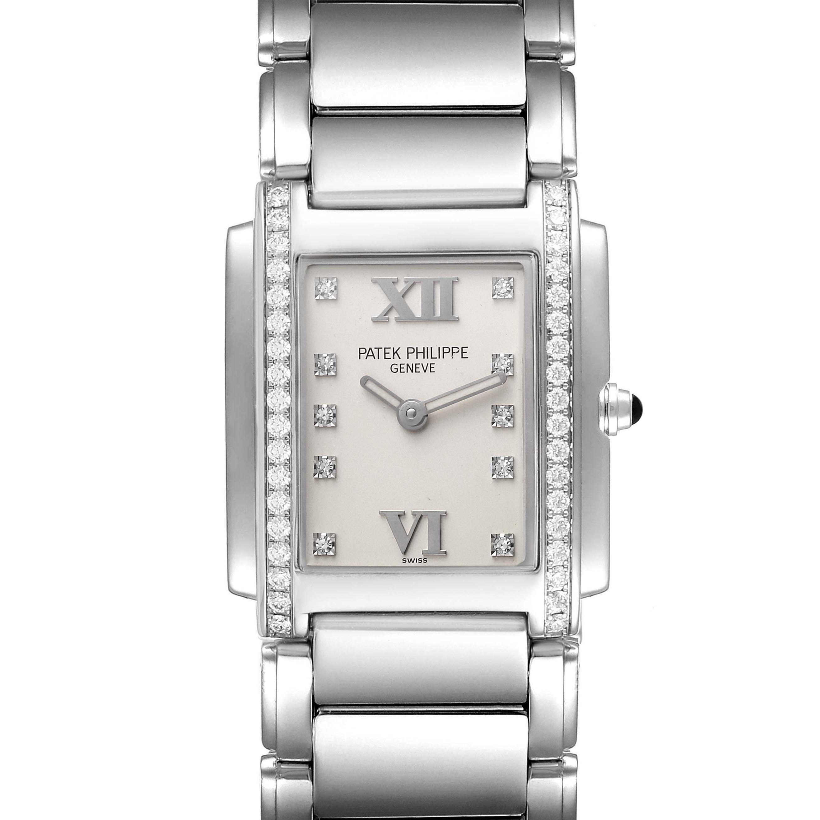 The image shows a frontal close-up of the Patek Philippe Twenty-4 4910/10A-010 Women's Stainless Steel Silver Dial 4910/10A-010 Women's Stainless Steel Silver Dial watch, highlighting its rectangular face, diamond bezels, and metal bracelet.