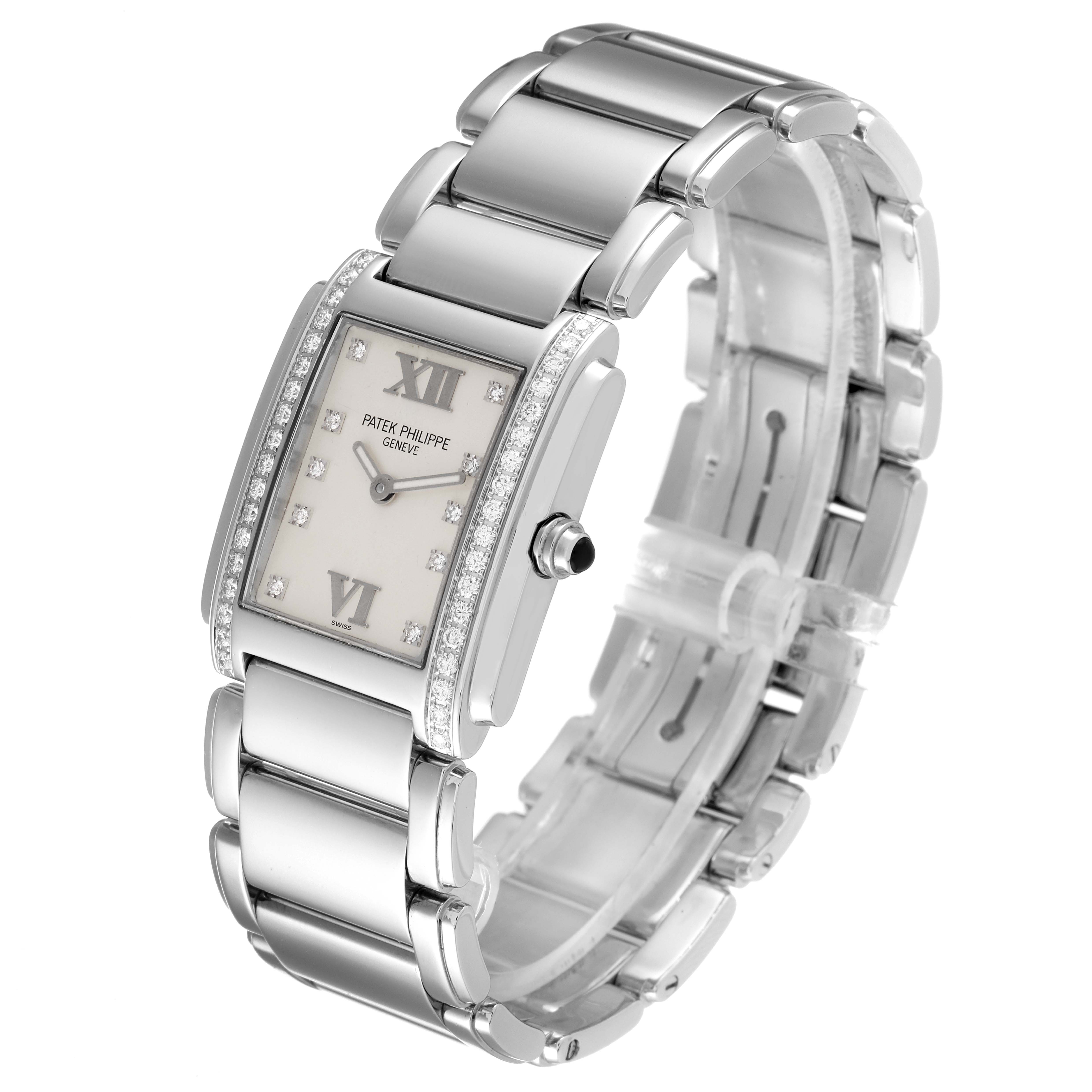 The image shows a Patek Philippe Twenty-4 4910/10A-010 Women's Stainless Steel Silver Dial 4910/10A-010 Women's Stainless Steel Silver Dial watch from a front three-quarter angle, highlighting its bracelet, face, and side crown.