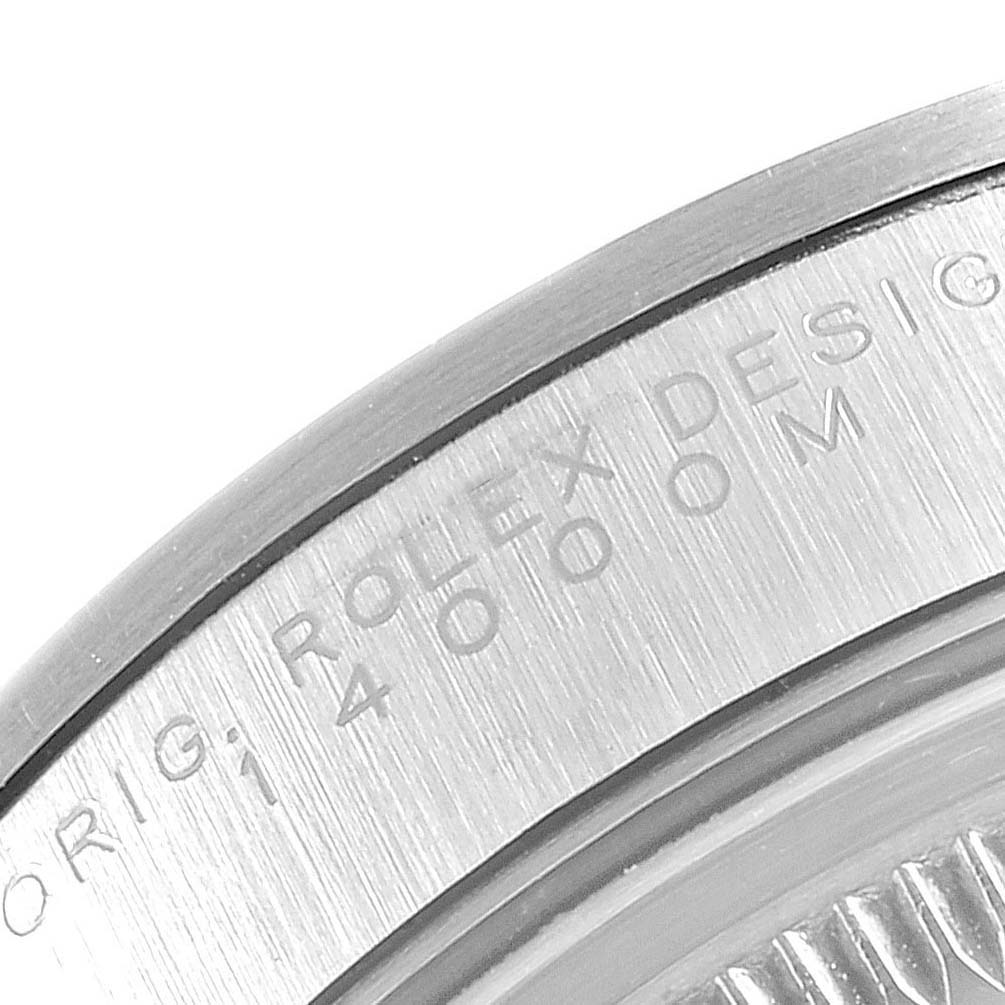 The image shows a close-up of the Rolex Air-King 14000 Men's Stainless Steel Black Dial 14000 Men's Stainless Steel Black Dial model's bezel, displaying engraved text.