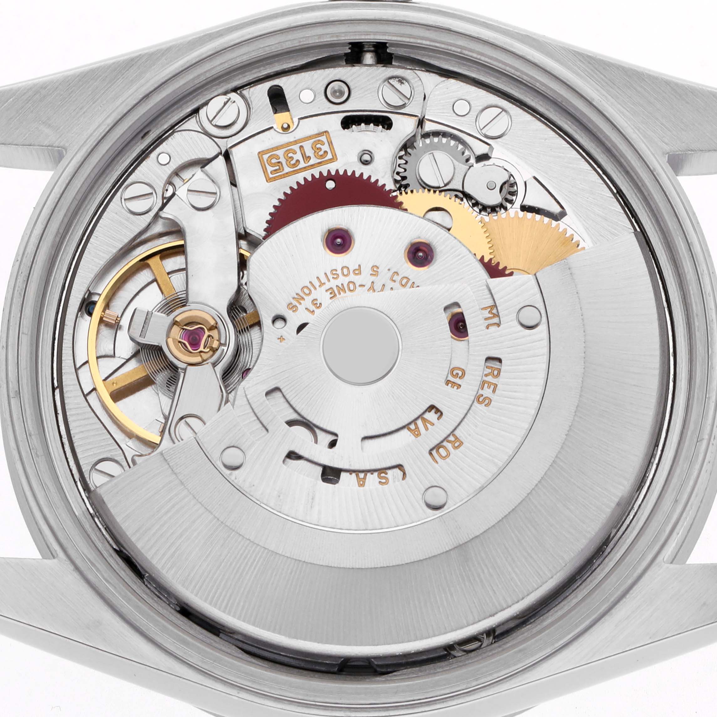 The image shows the movement mechanism of a Rolex Date 15210 Men
s Stainless Steel Blue Dial 15210 Men
s Stainless Steel Blue Dial watch viewed from the back, displaying gears and balance wheel.