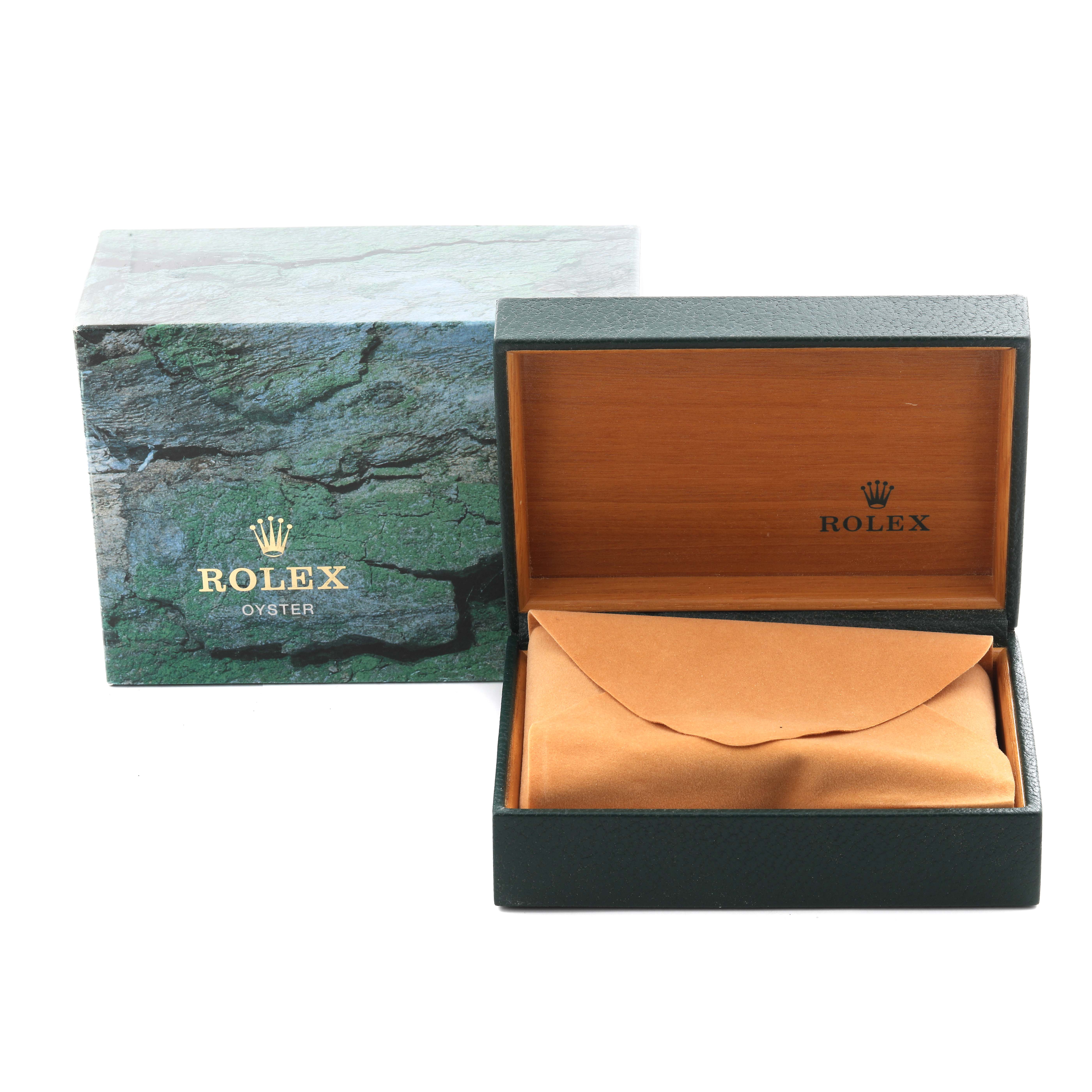 The image shows the packaging of a Rolex Date 15210 Men
s Stainless Steel Blue Dial 15210 Men
s Stainless Steel Blue Dial model, featuring an outer box and an inner box with a cushion inside.