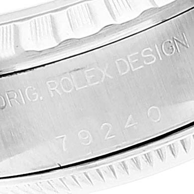 Close-up of the case side and bezel of a Rolex Date 79240 Women
s Stainless Steel Blue Dial 79240 Women
s Stainless Steel Blue Dial model, showing the engravings and serial number.