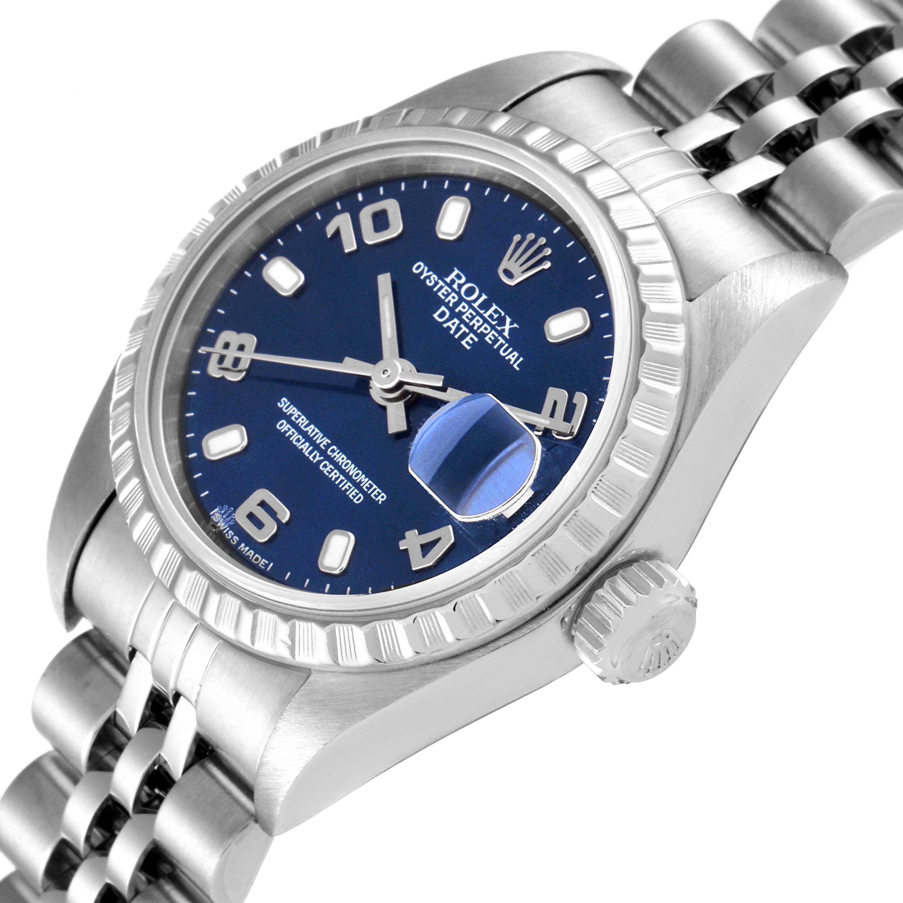 This image shows the Rolex Date 79240 Women
s Stainless Steel Blue Dial 79240 Women
s Stainless Steel Blue Dial watch at an oblique angle, highlighting the blue dial, crown, bezel, and part of the bracelet.