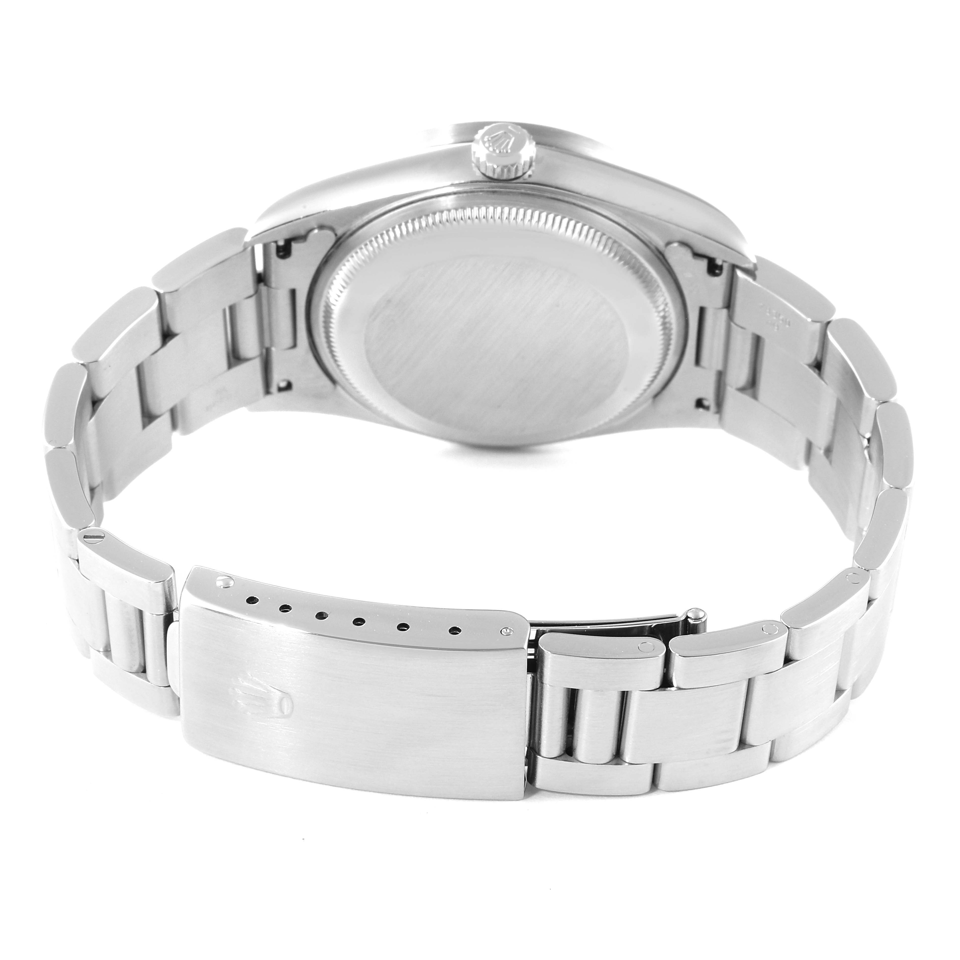 The image shows the back view of a Rolex Date 15210 Men's Stainless Steel Blue Dial 15210 Men's Stainless Steel Blue Dial model watch, highlighting the case back and the clasp of the metal bracelet.