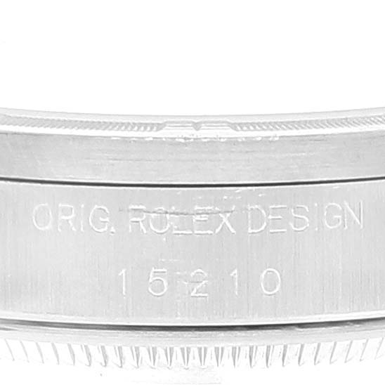 This is a close-up view of the side of a Rolex Date 15210 Men's Stainless Steel Blue Dial 15210 Men's Stainless Steel Blue Dial model, showing the engraved design and model number 15210.