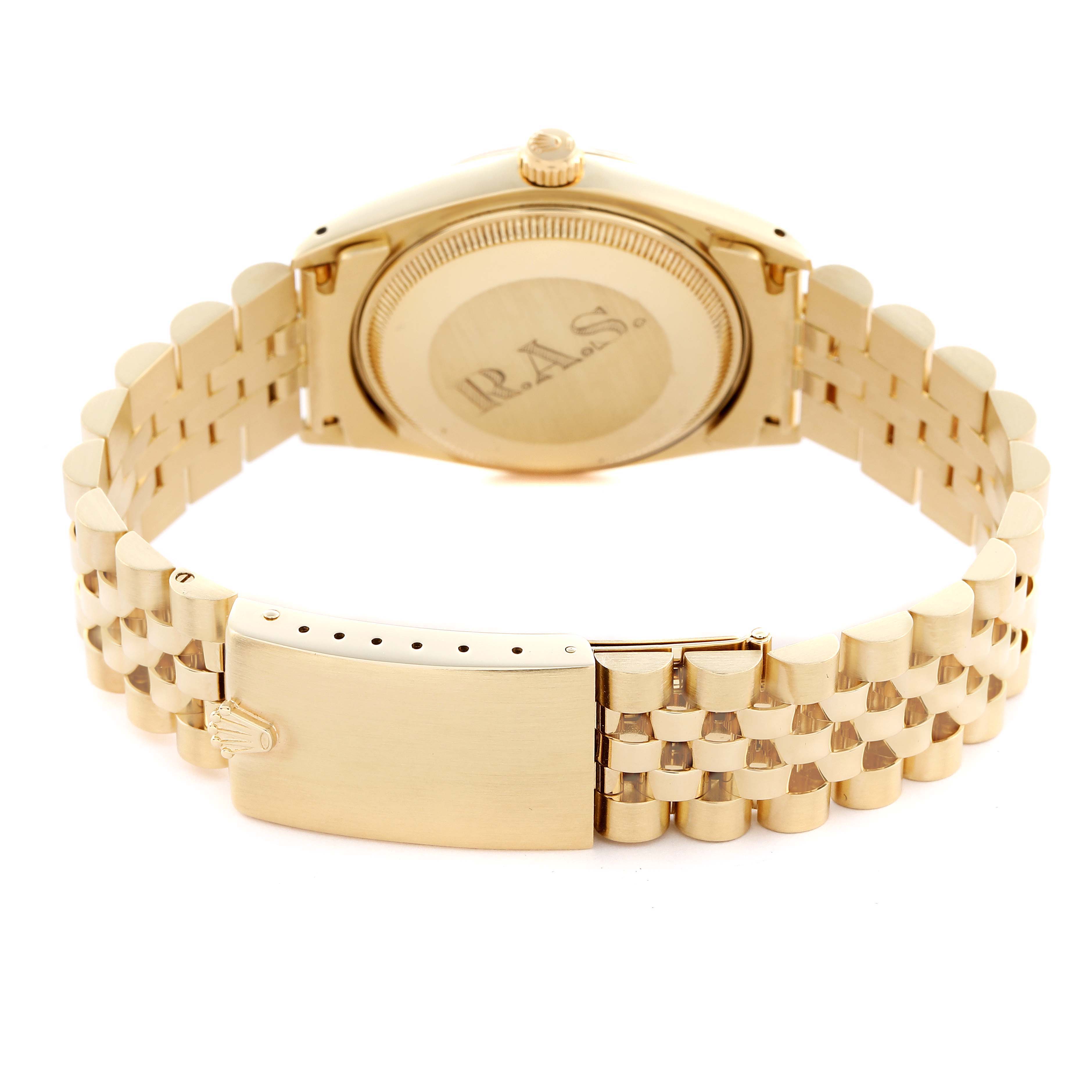 The image shows the back and bracelet of a Rolex Date model, highlighting the clasp and case back.