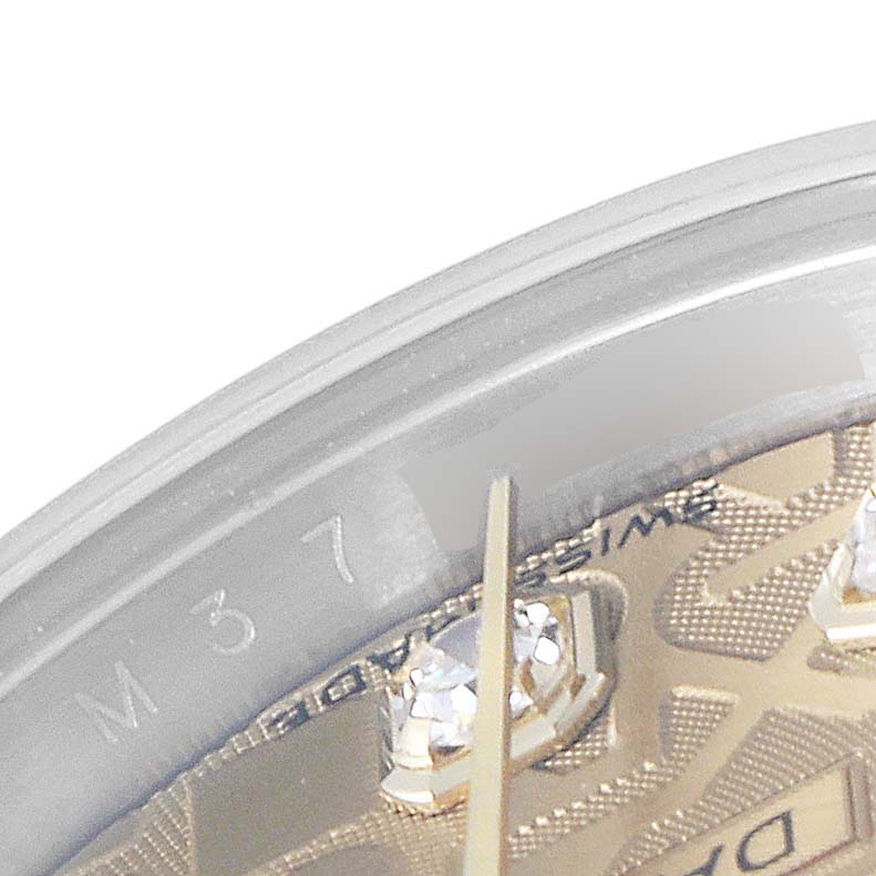This image shows a close-up of the edge of the dial and bezel of a Rolex Datejust 179173 Women
s Steel and Gold (two tone) Champagne Dial 179173 Women
s Steel and Gold (two tone) Champagne Dial watch, highlighting the diamond hour markers.