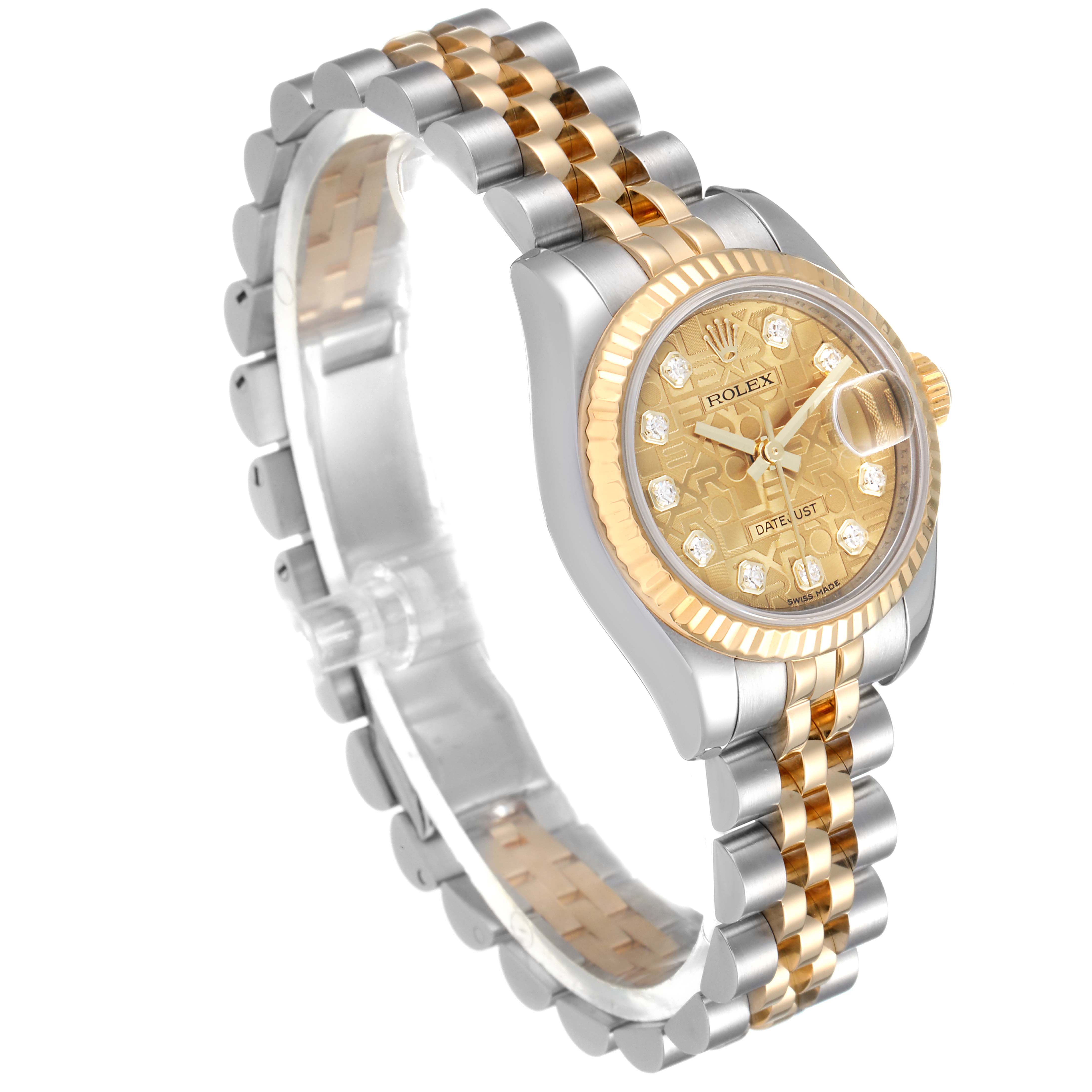 This Datejust Rolex watch is shown at a slight angle, revealing its gold and silver bracelet, dial, and fluted bezel.