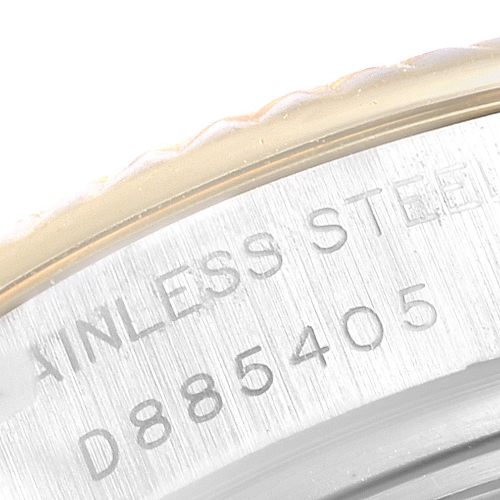 Close-up of the serial number and 'stainless steel' engraving on a Rolex Datejust 179173 Women's Steel and Gold (two tone) Silver Dial 179173 Women's Steel and Gold (two tone) Silver Dial watch case.
