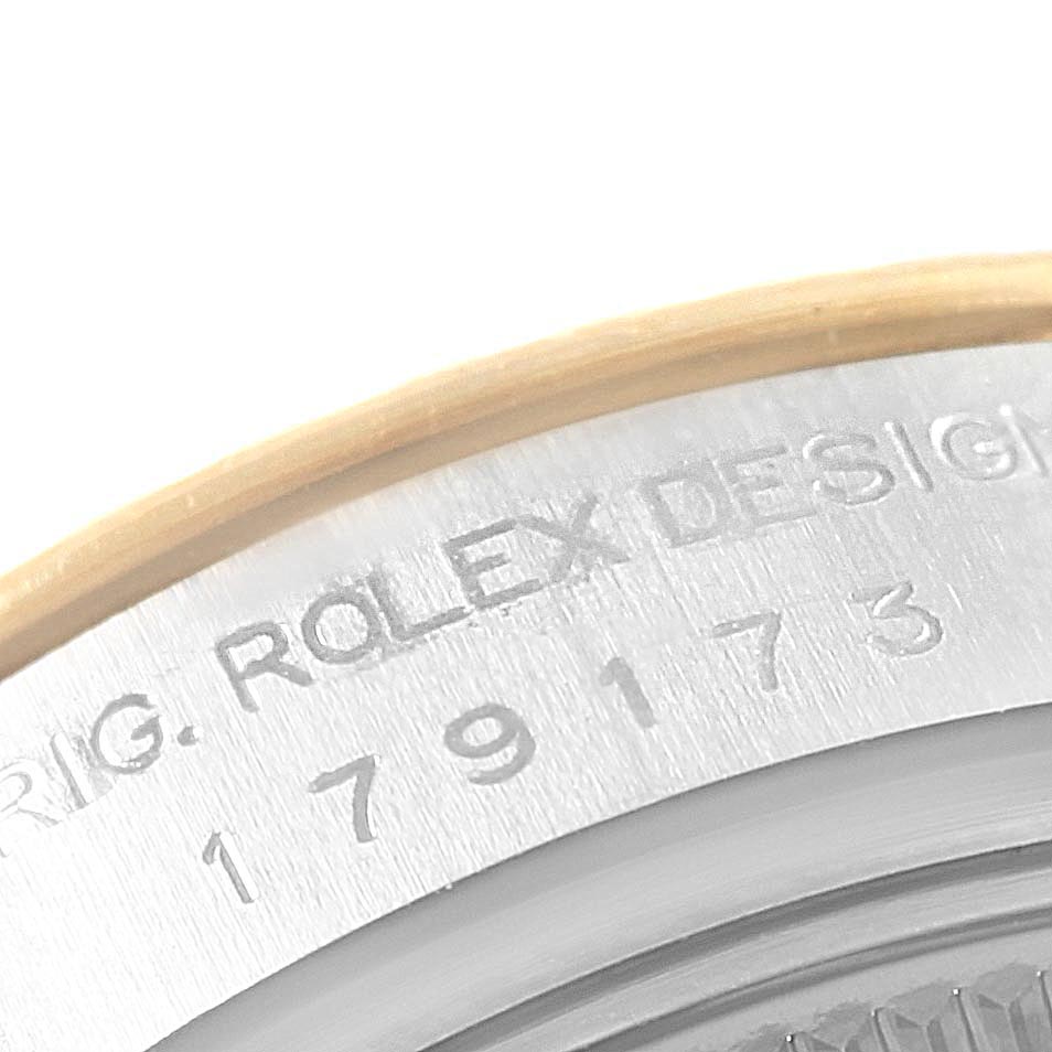 This image shows a close-up view of the case back and reference number of a Rolex Datejust 179173 Women's Steel and Gold (two tone) Silver Dial 179173 Women's Steel and Gold (two tone) Silver Dial watch.