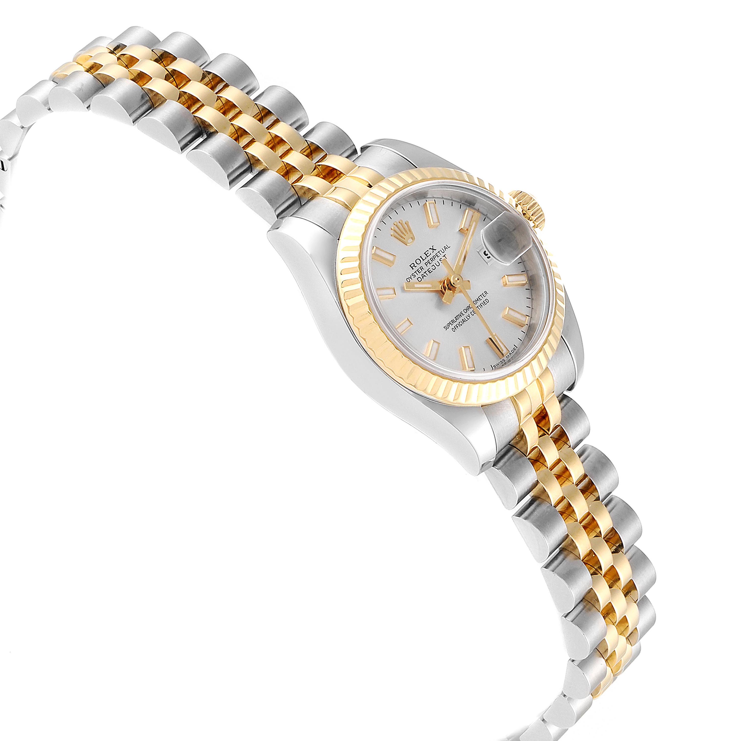 This image shows a Rolex Datejust 179173 Women's Steel and Gold (two tone) Silver Dial 179173 Women's Steel and Gold (two tone) Silver Dial watch angled from the side, highlighting its two-tone bracelet, bezel, and dial.