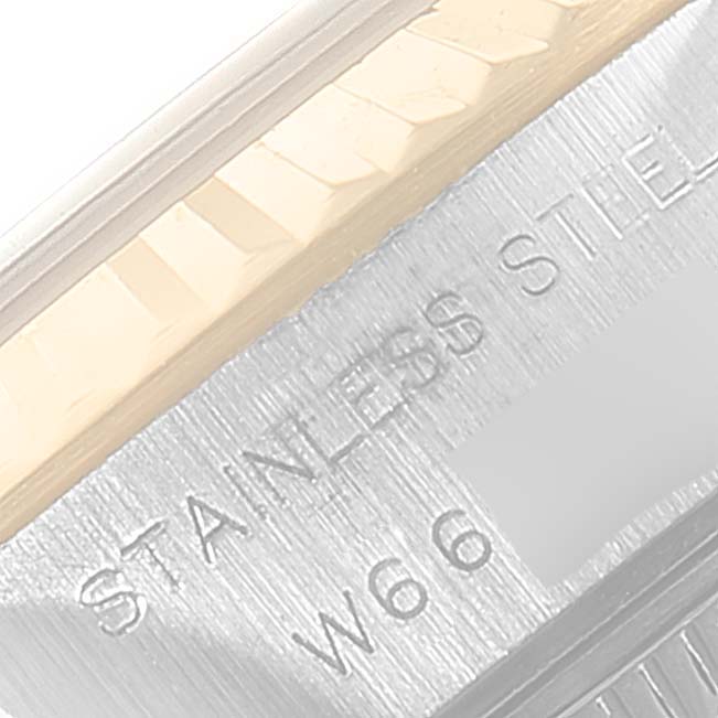 This close-up image shows the edge of the bezel and a part of the case back of a Rolex Datejust 69173 Women's Steel and Gold (two tone) White Dial 69173 Women's Steel and Gold (two tone) White Dial watch, highlighting the text "STAINLESS STEEL."