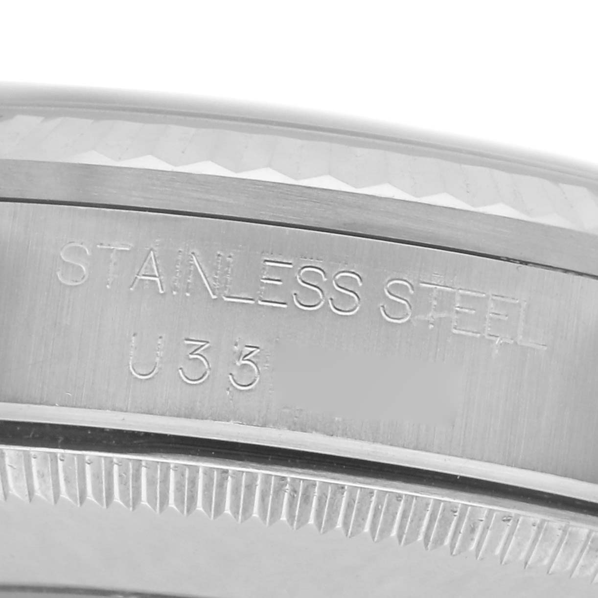 This image shows a close-up of the case back of a Rolex Mid-Size 68274 Women's Stainless Steel Black Dial 68274 Women's Stainless Steel Black Dial watch, highlighting the stainless steel engravings.