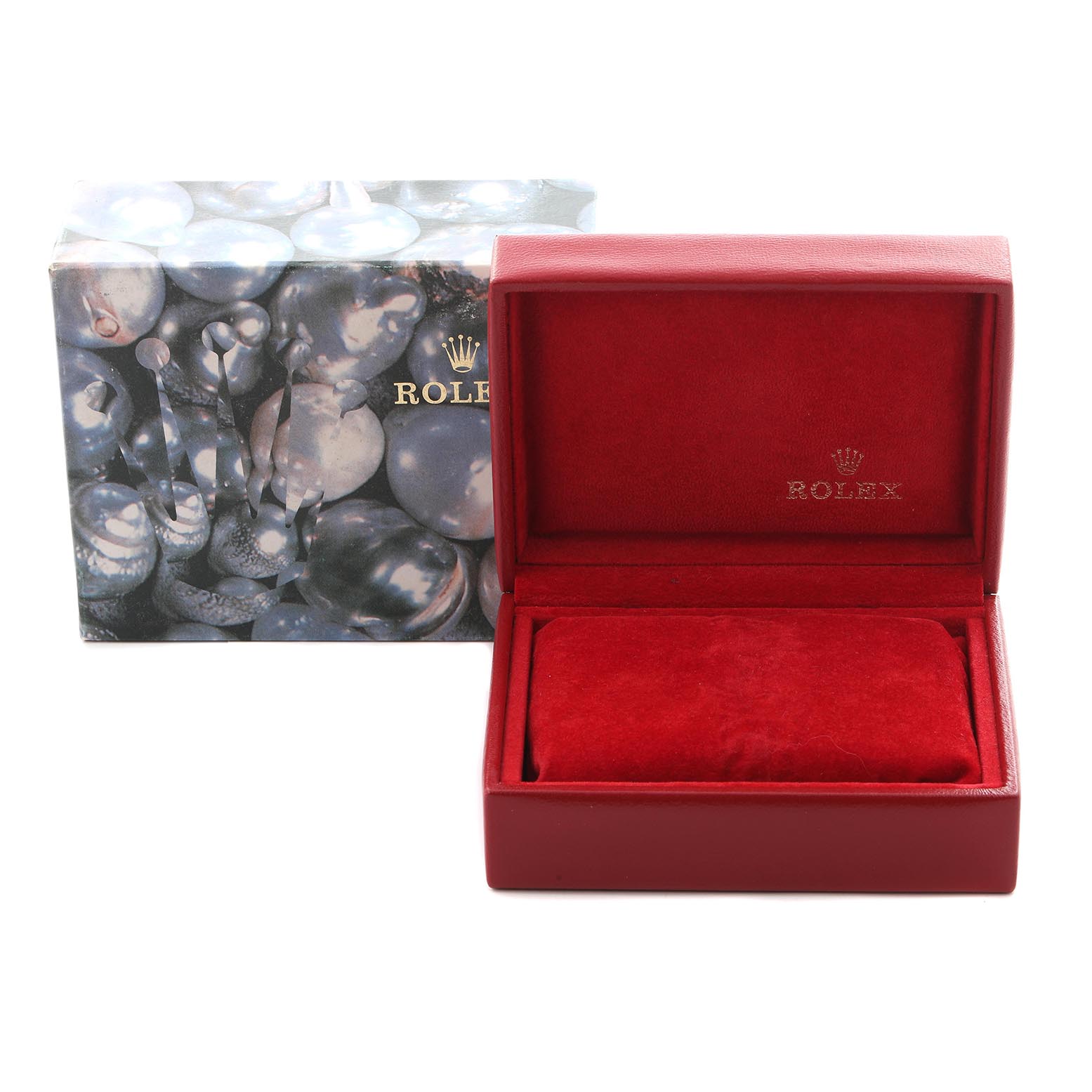 The image shows an open red Rolex watch box with its branded outer packaging visible.