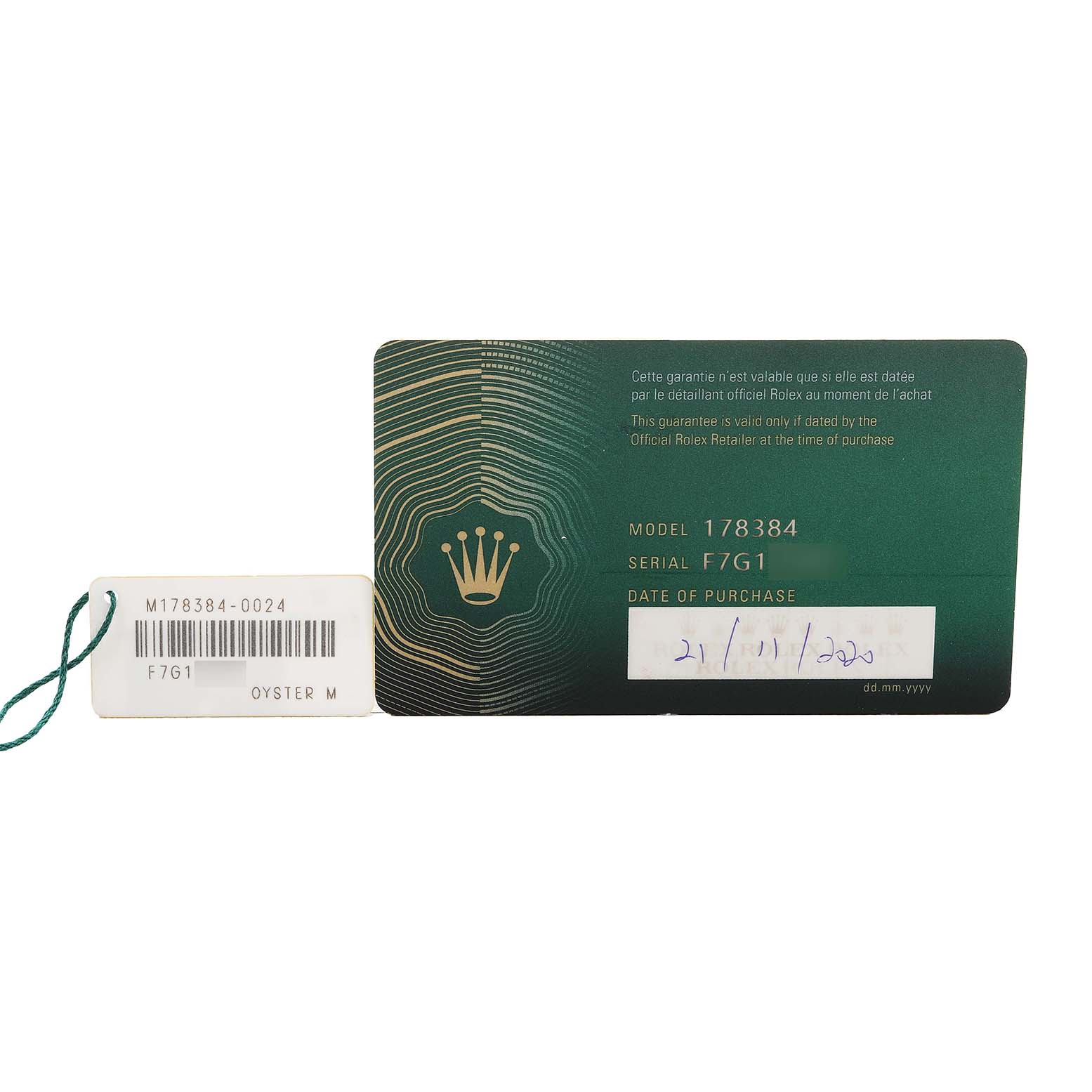 The image shows a green Rolex warranty card and a tag for the Datejust model.