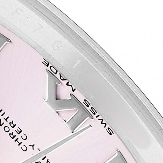 The close-up image of the Rolex Datejust 178384 Women's Stainless Steel Pink Dial watch shows the edge of the dial with Roman numerals and "SWISS MADE" text.