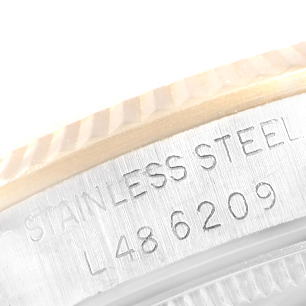 This close-up image of the Rolex Mid-Size 68273 Women
s Steel and Gold (two tone) Champagne Dial 68273 Women
s Steel and Gold (two tone) Champagne Dial watch shows the case back highlighting the etched "STAINLESS STEEL" text and the serial number L486209.