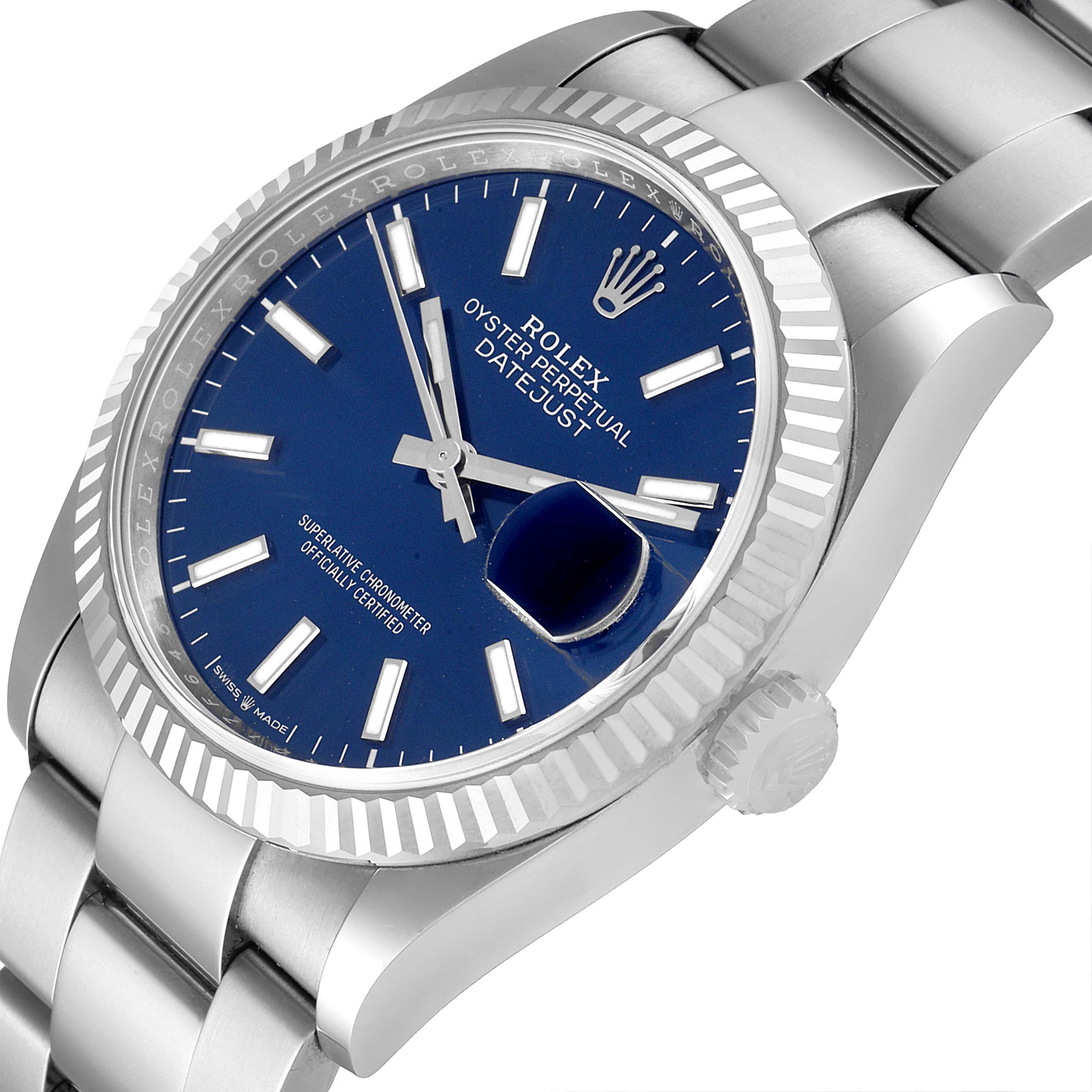 This image shows a Rolex Datejust 126234 Men's Stainless Steel Blue Dial 126234 Men's Stainless Steel Blue Dial watch at a slight angle, highlighting its blue dial, fluted bezel, and stainless steel bracelet.