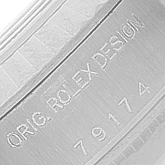 This image shows a close-up of the serial number engraving on the side of the case for the Rolex Datejust 79174 Women
s Stainless Steel Silver Dial 79174 Women
s Stainless Steel Silver Dial model.