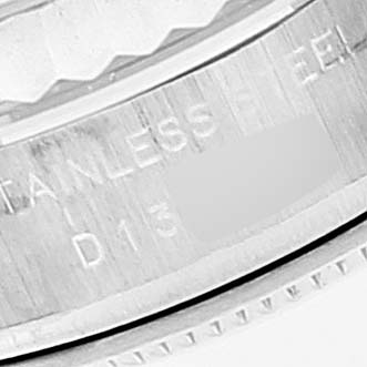 The image shows a close-up of the engravings on the side of a Rolex Datejust 179174 Women's Stainless Steel Pink Dial 179174 Women's Stainless Steel Pink Dial stainless steel watch casing.
