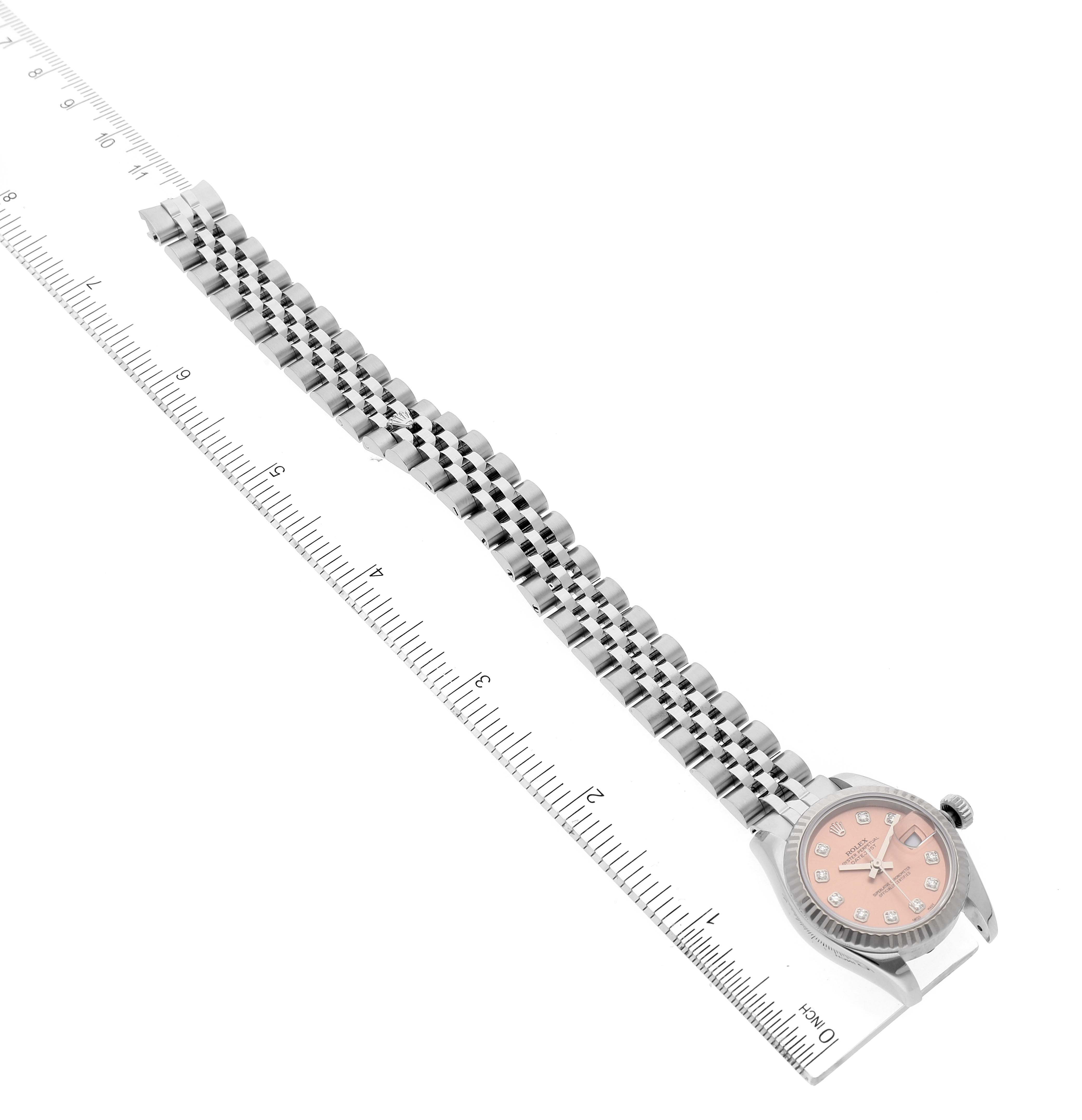 The image shows a Rolex Datejust 179174 Women's Stainless Steel Pink Dial 179174 Women's Stainless Steel Pink Dial watch with a full view of the dial, bracelet, and some ruler measurements.