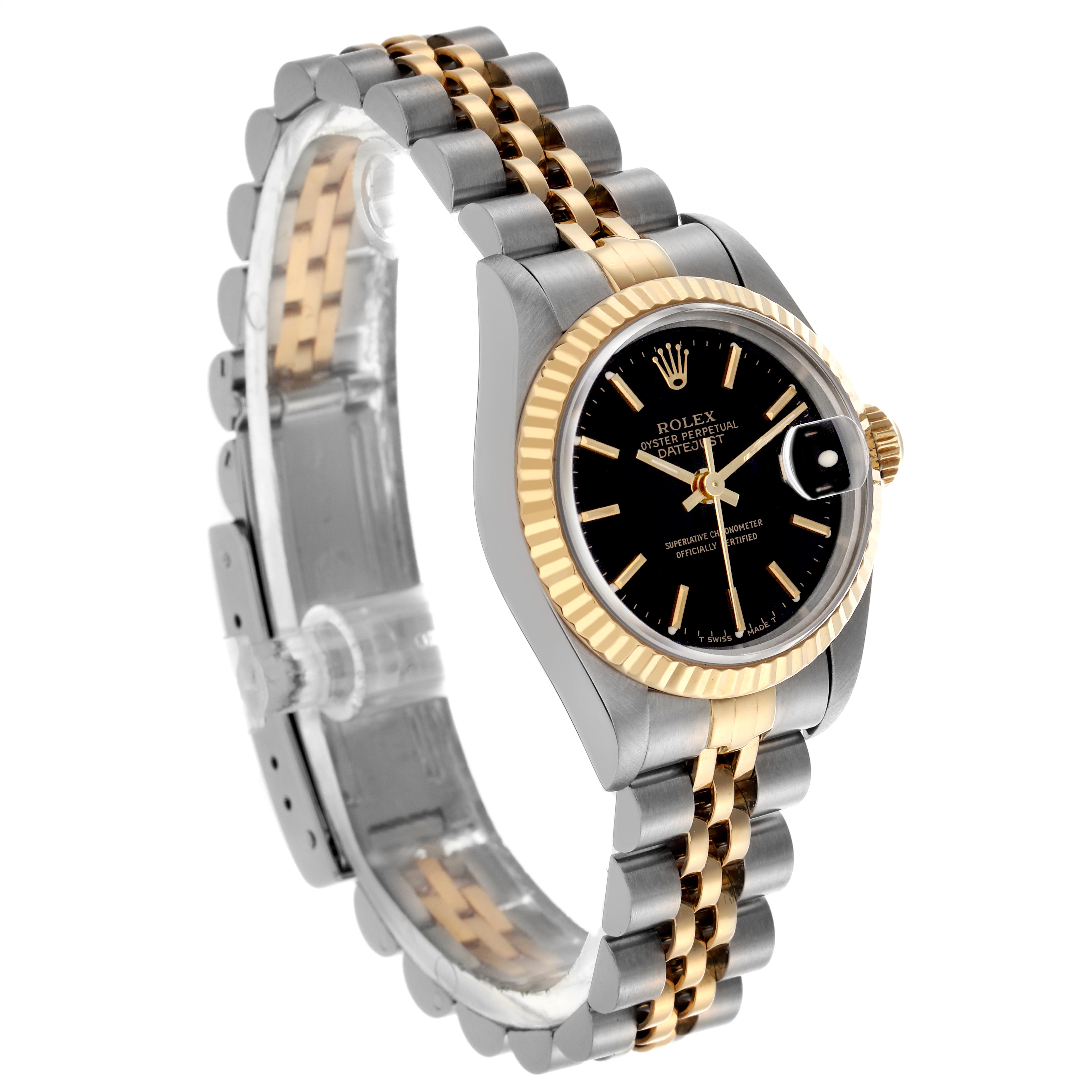 The Rolex Datejust 69173 Women
s Steel and Gold (two tone) Black Dial 69173 Women
s Steel and Gold (two tone) Black Dial watch is shown at a three-quarter angle, displaying the face, bezel, crown, and two-tone bracelet.