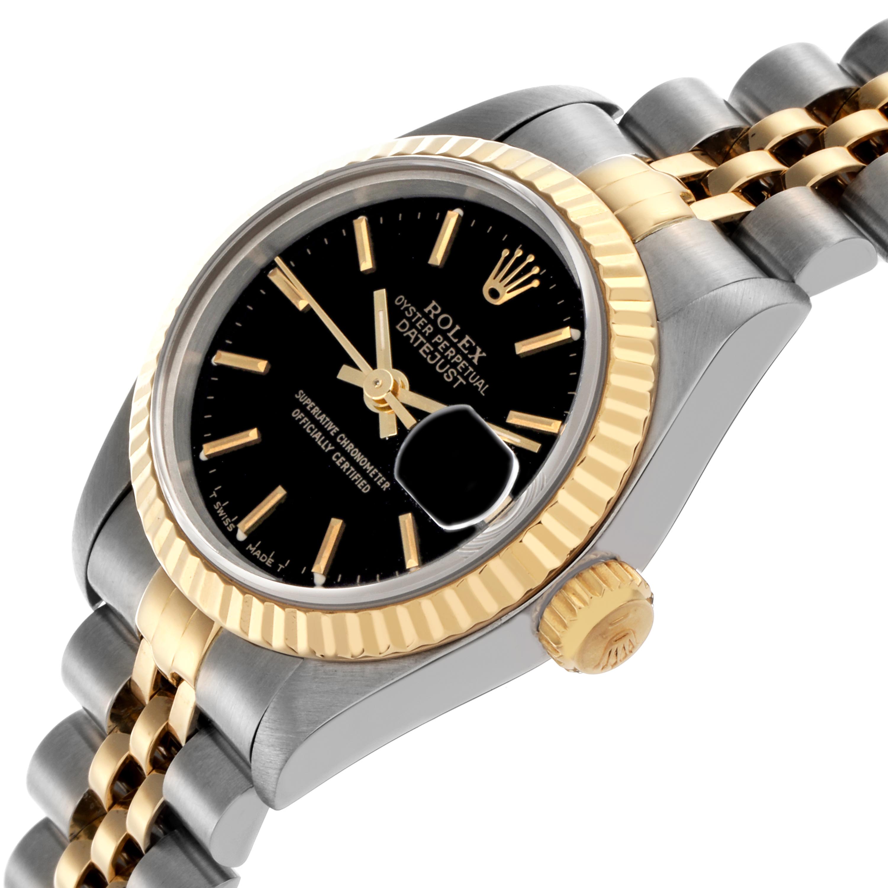 The Rolex Datejust 69173 Women
s Steel and Gold (two tone) Black Dial 69173 Women
s Steel and Gold (two tone) Black Dial is shown at an angled view, highlighting the dial, bezel, crown, and two-tone bracelet.