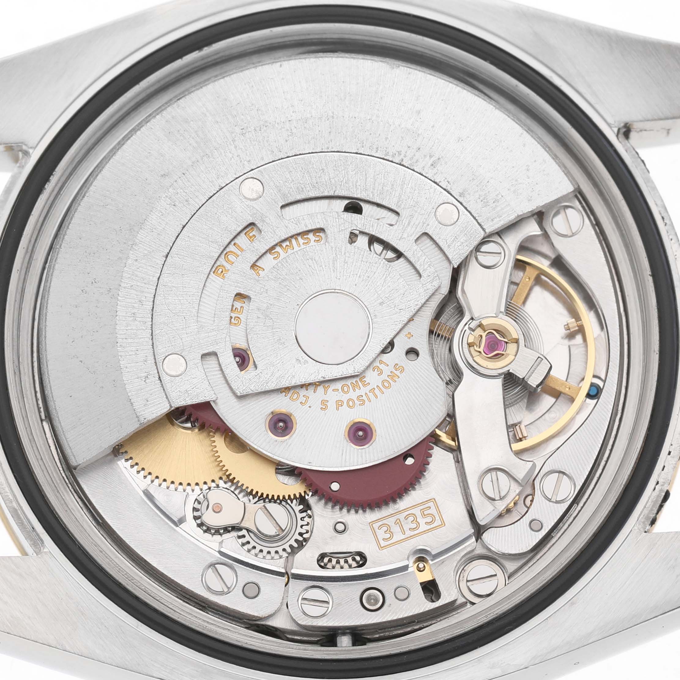 The image shows the movement and internal mechanism of a Rolex Datejust 116233 Men's Steel and Gold (two tone) Champagne Dial watch from a back view, highlighting gear and rotor details.