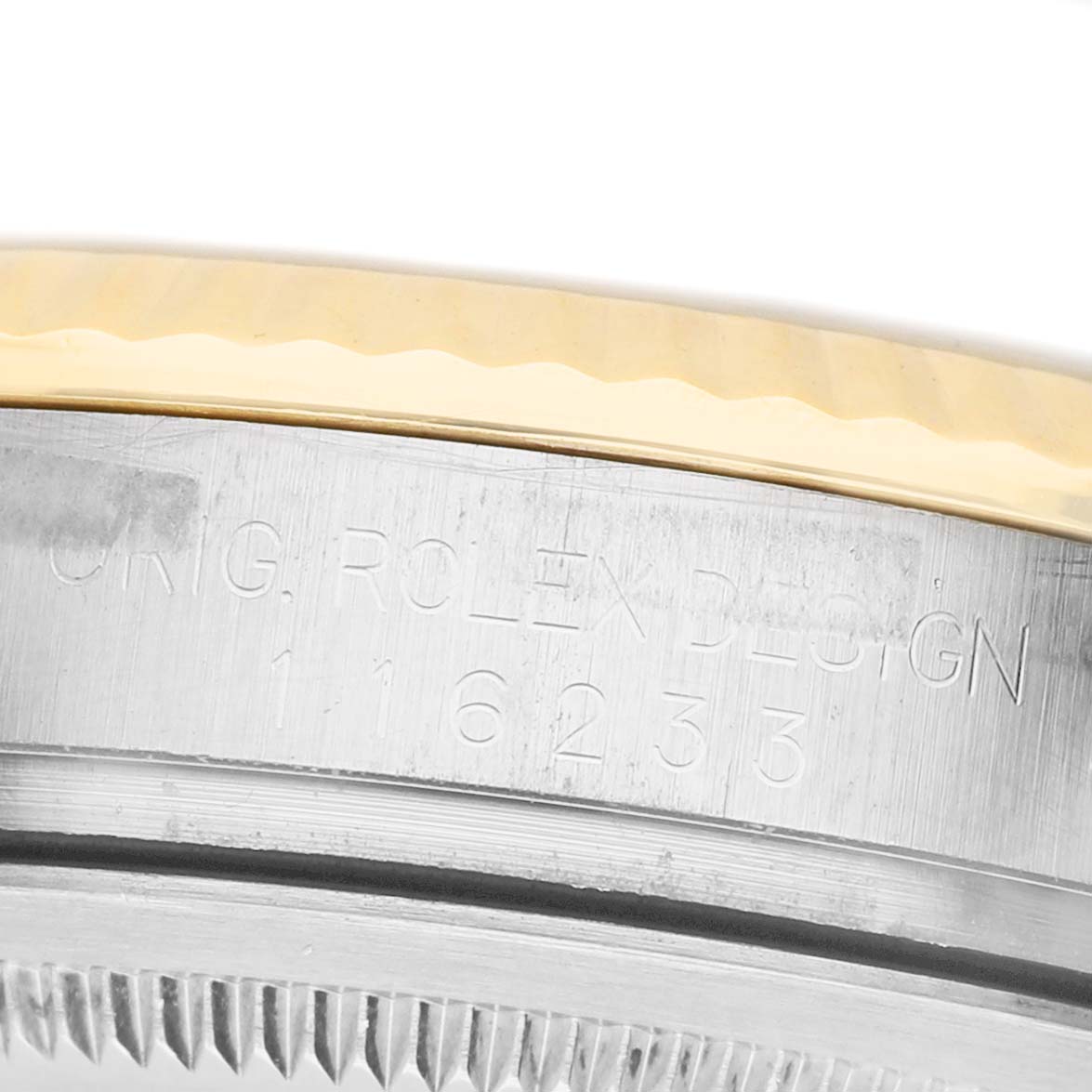 The image shows a close-up of the case side of a Rolex Datejust 116233 Men's Steel and Gold (two tone) Champagne Dial, highlighting the engraved design number.