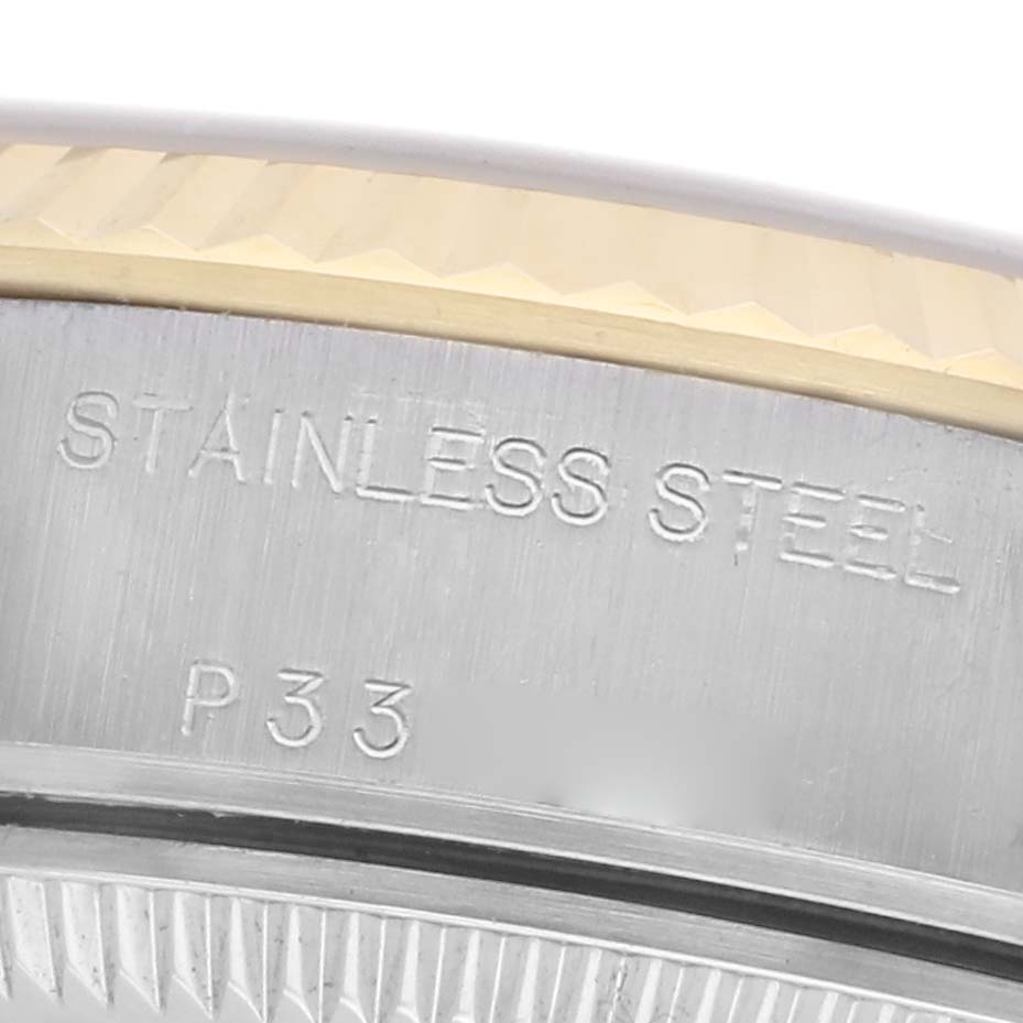 The image shows a close-up of the side of a Rolex Datejust 79173 Women's Steel and Gold (two tone) Champagne Dial 79173 Women's Steel and Gold (two tone) Champagne Dial, highlighting the stainless steel material and part of the bezel.