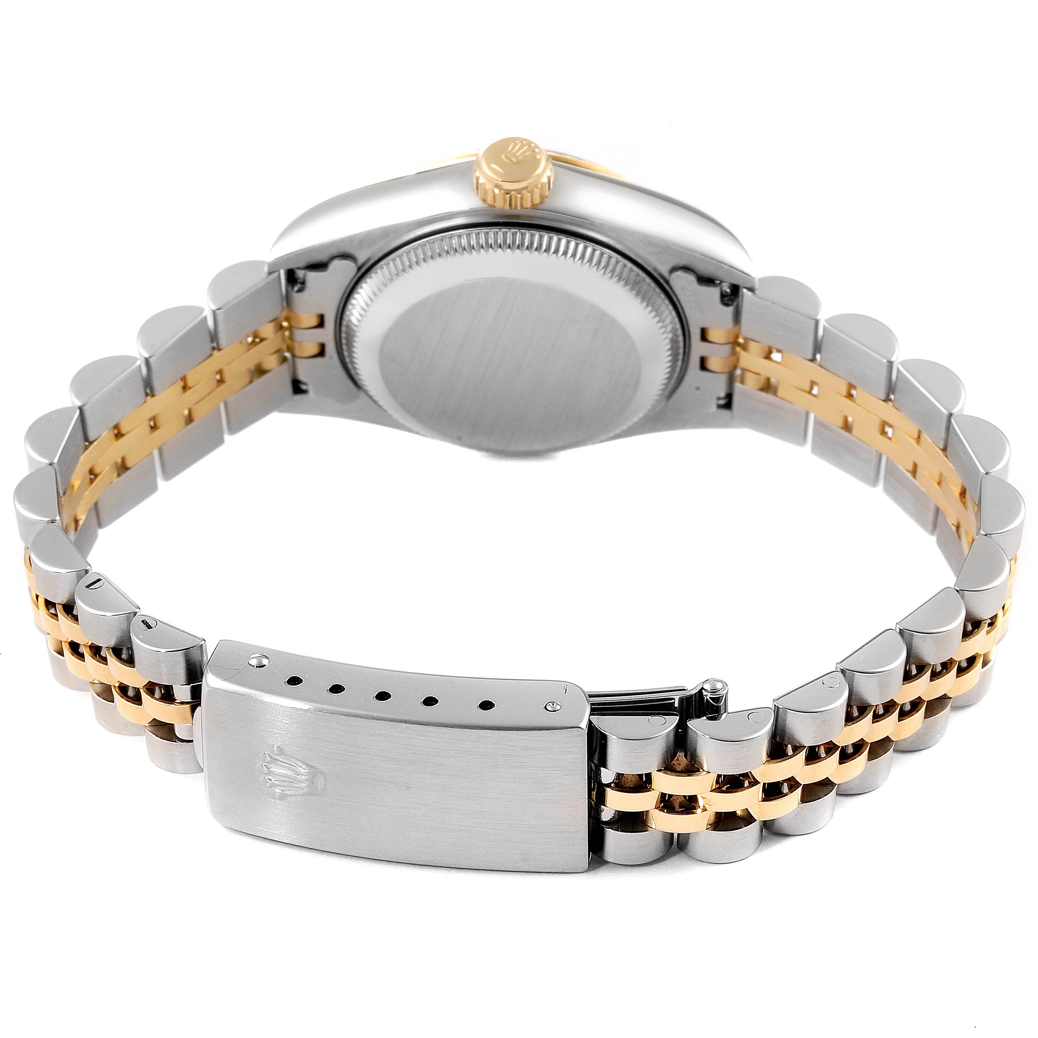 The image shows the backview of a Rolex Datejust 69173 Women
s Steel and Gold (two tone) Mother of Pearl Dial 69173 Women
s Steel and Gold (two tone) Mother of Pearl Dial watch, focusing on the clasp, bracelet, and caseback.