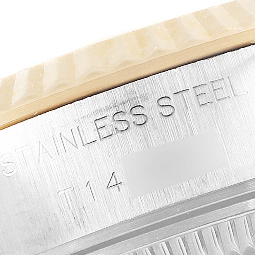 This close-up image shows the side of the bezel and case with engravings on a Rolex Datejust 69173 Women
s Steel and Gold (two tone) Mother of Pearl Dial 69173 Women
s Steel and Gold (two tone) Mother of Pearl Dial watch.