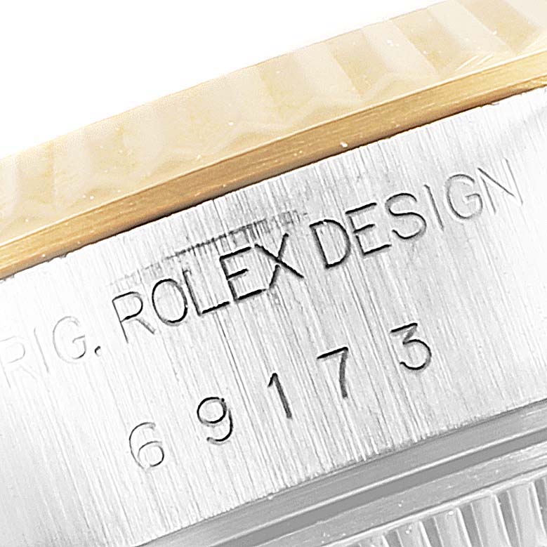 The image shows an engraved side view of the bezel and case of a Rolex Datejust 69173 Women
s Steel and Gold (two tone) Mother of Pearl Dial 69173 Women
s Steel and Gold (two tone) Mother of Pearl Dial watch.