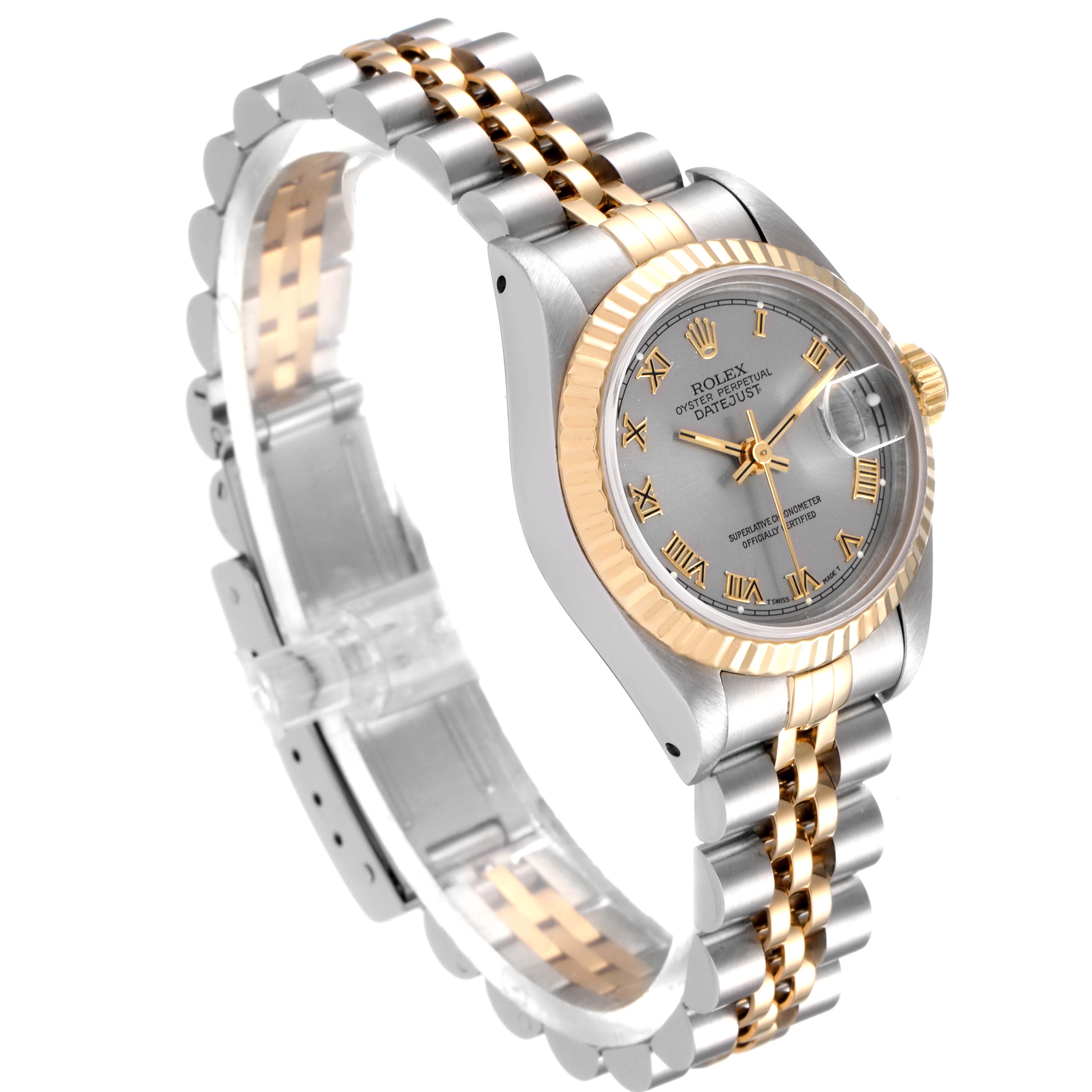 The Rolex Datejust 69173 Women
s Steel and Gold (two tone) Silver Dial 69173 Women
s Steel and Gold (two tone) Silver Dial watch is shown at an angled side view, highlighting its silver and gold bracelet and grey dial with gold Roman numerals.