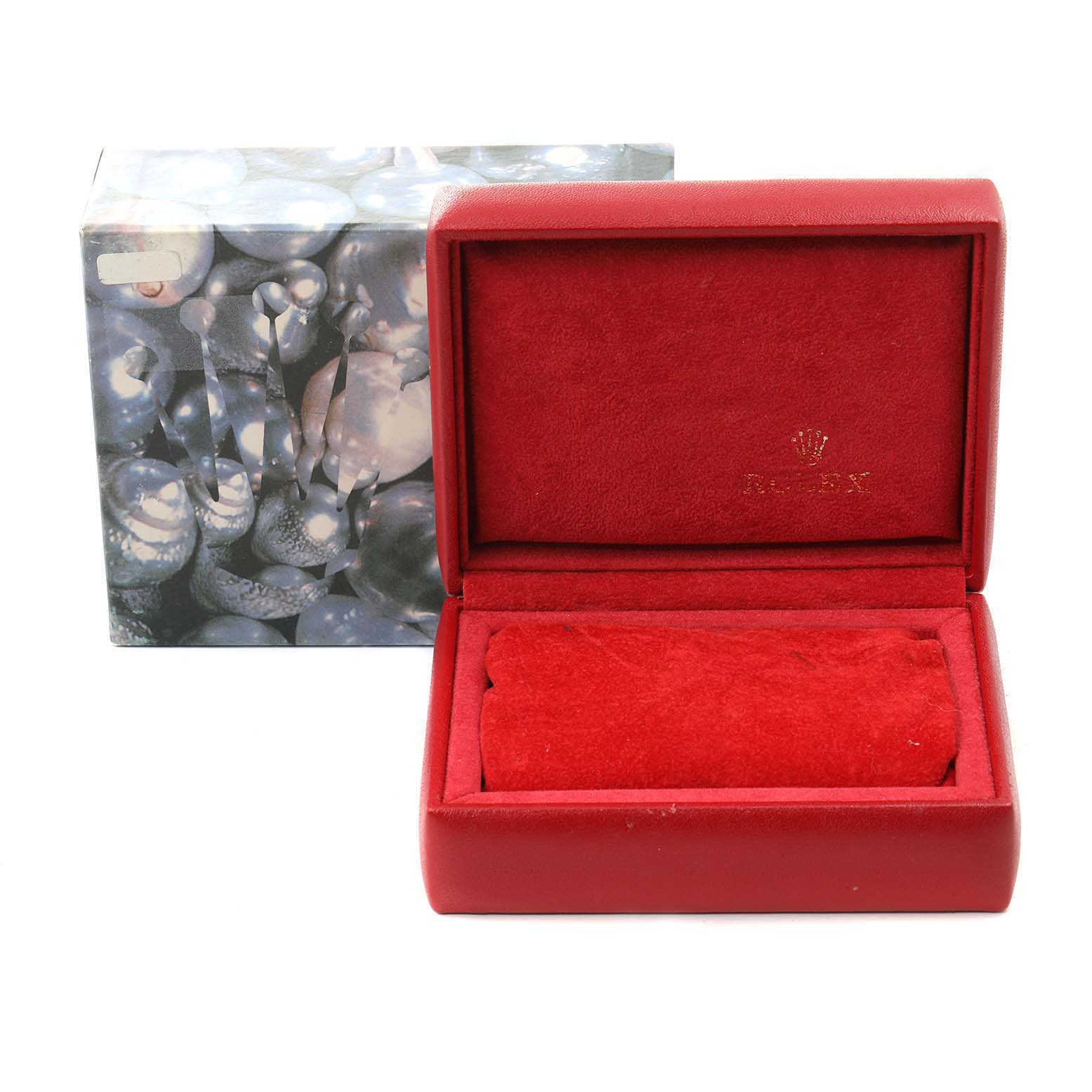 An open red Rolex watch box with a red velvet interior and an outer decorative box for the Datejust model by Rolex is shown.