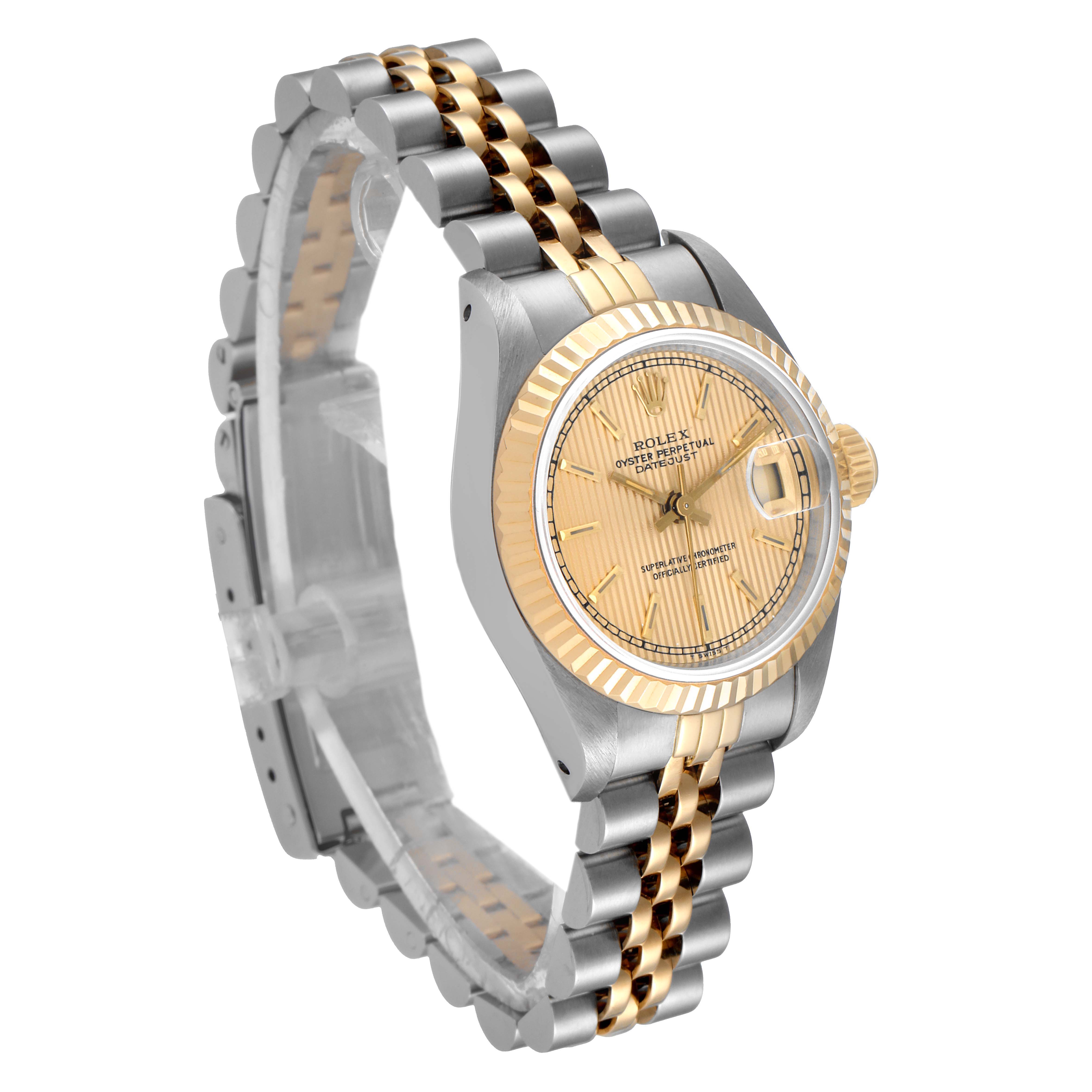 The image shows a Rolex Datejust 69173 Women
s Steel and Gold (two tone) Champagne Dial 69173 Women
s Steel and Gold (two tone) Champagne Dial watch at a slight angle, highlighting its two-tone bracelet, fluted bezel, and gold dial.