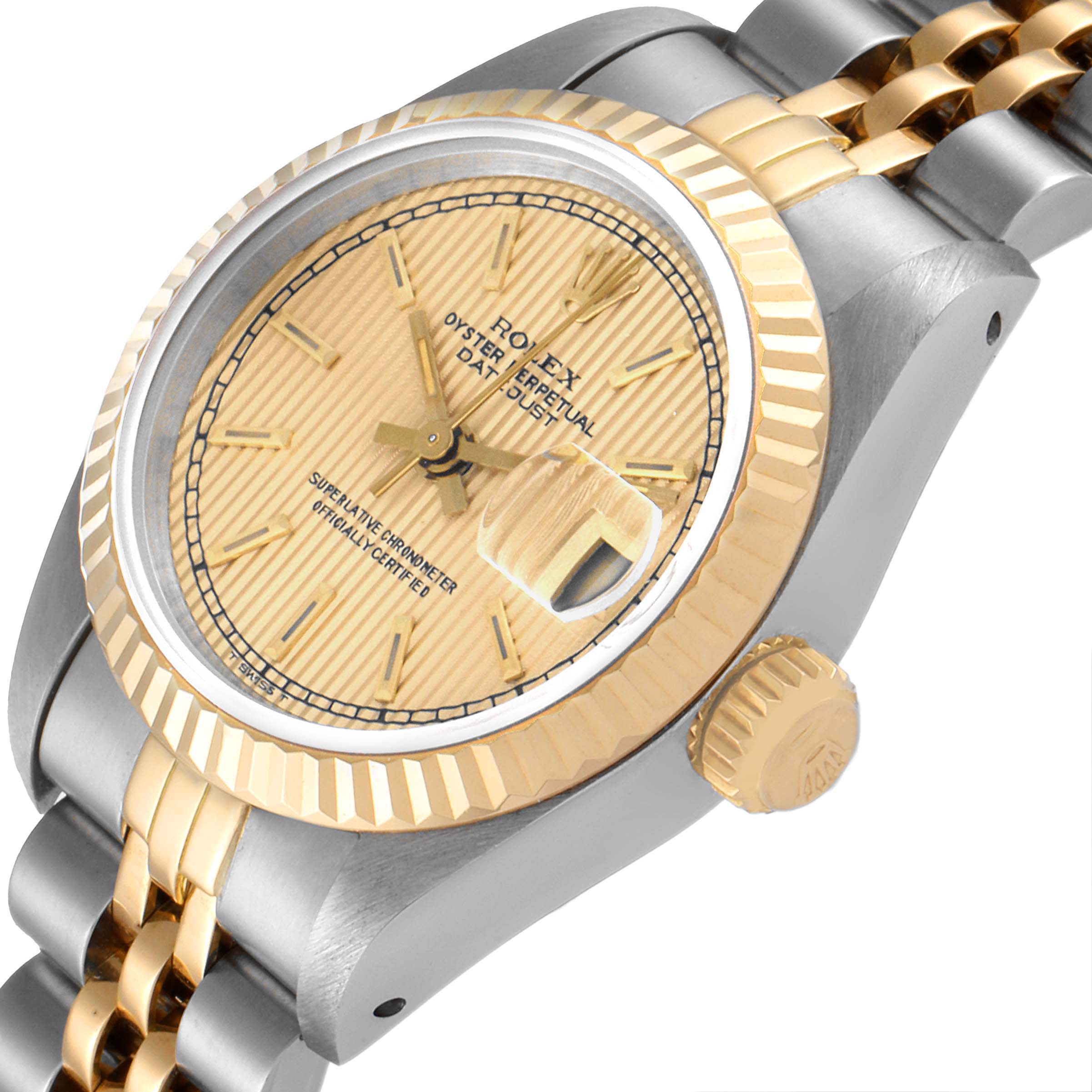 This image shows a close-up angled view of the face, bezel, crown, and part of the bracelet of a Rolex Datejust 69173 Women
s Steel and Gold (two tone) Champagne Dial 69173 Women
s Steel and Gold (two tone) Champagne Dial watch.