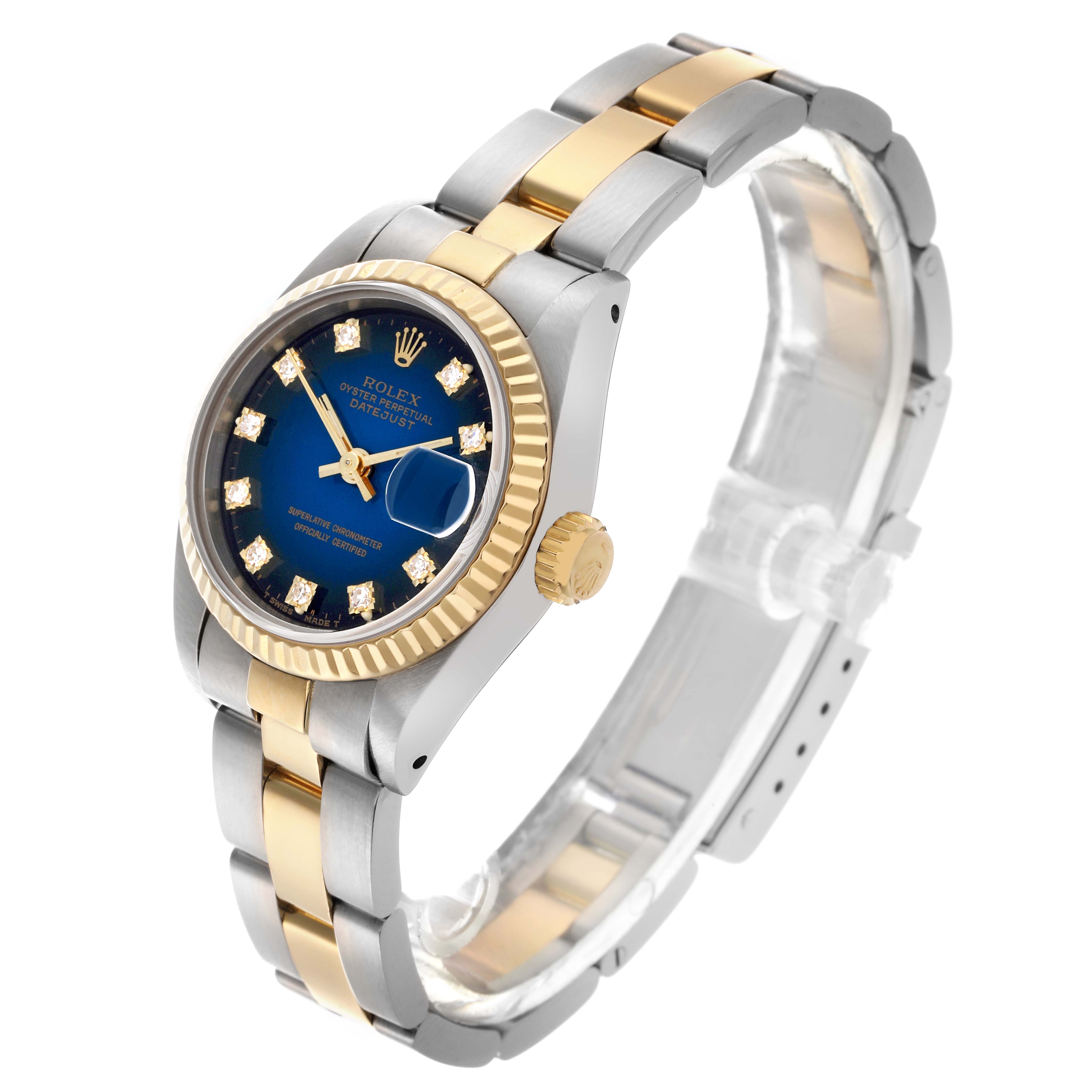 The Rolex Datejust 69173 Women's Steel and Gold (two tone) Blue Dial 69173 Women's Steel and Gold (two tone) Blue Dial watch is shown at a three-quarter angle, highlighting its blue dial, gold and silver two-tone bracelet, and fluted bezel.