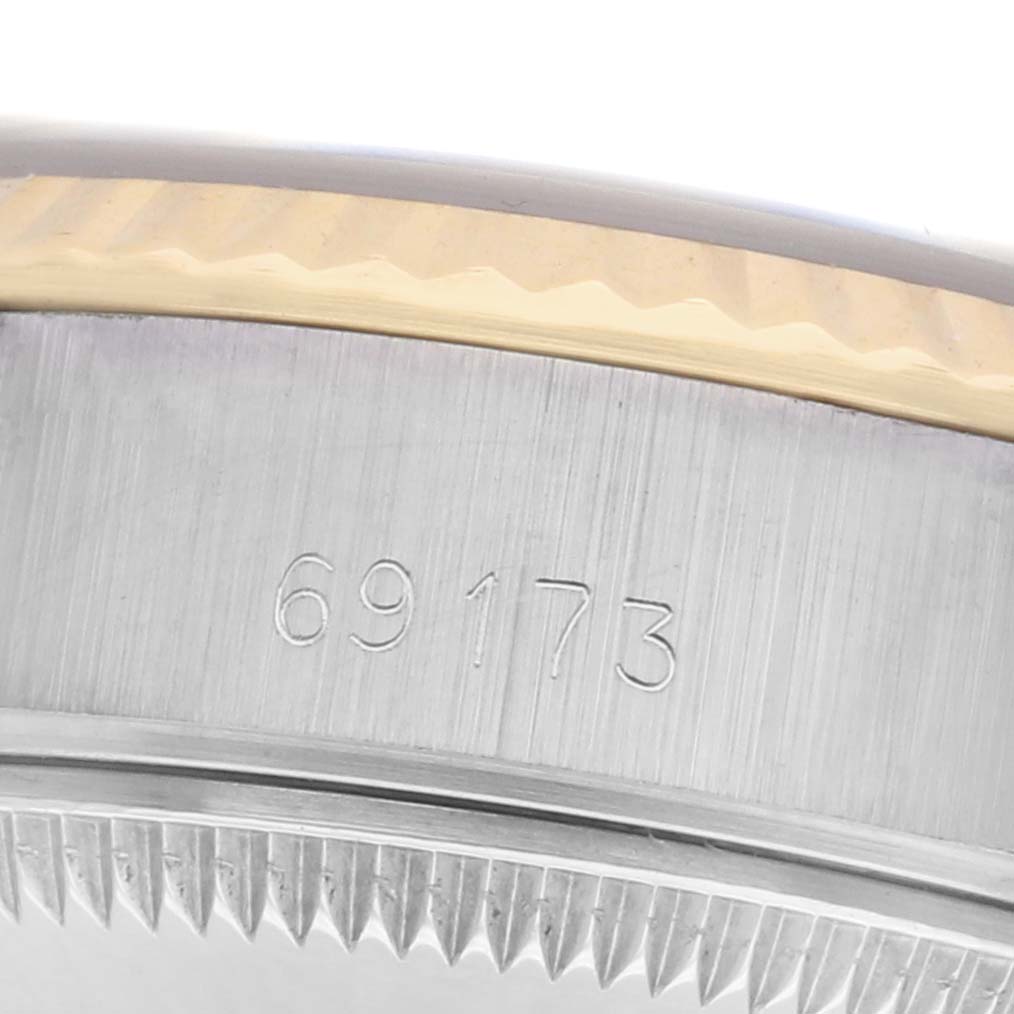The image shows a close-up of the case side of a Rolex Datejust 69173 Women's Steel and Gold (two tone) Blue Dial 69173 Women's Steel and Gold (two tone) Blue Dial, highlighting the model number 69173 and the fluted bezel edge.