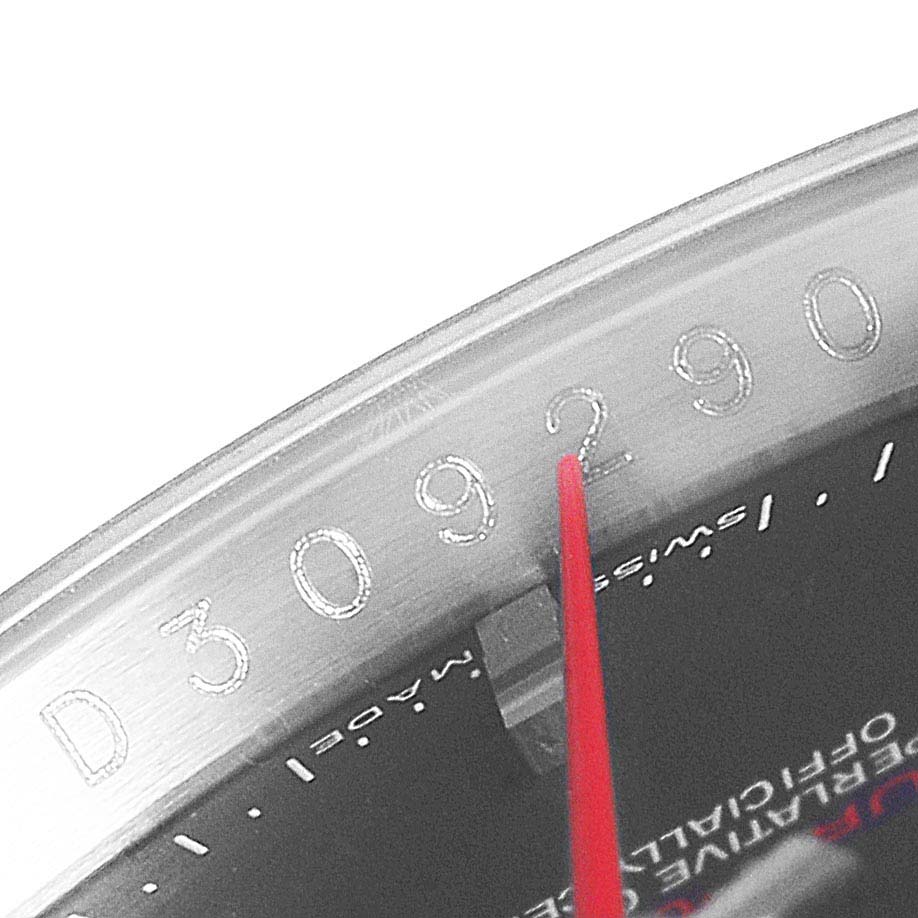 This image shows a close-up of the bezel and part of the dial of a Rolex Turn-o-Graph 116264 Men's Stainless Steel Black Dial 116264 Men's Stainless Steel Black Dial watch, highlighting the serial number.