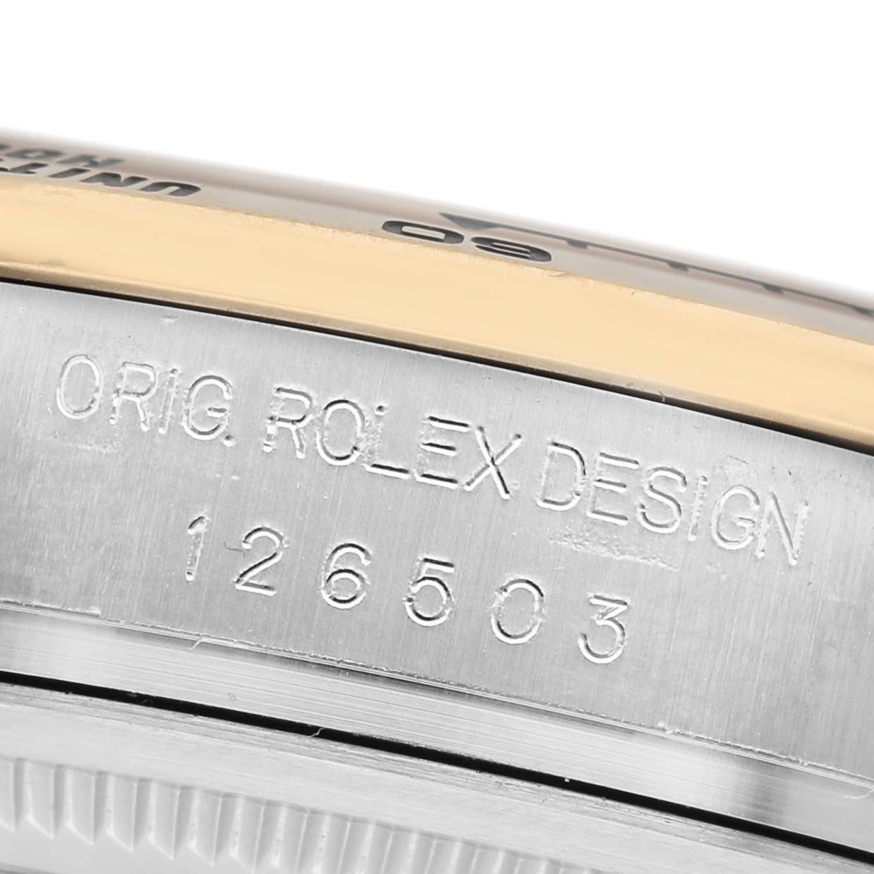 The image shows the side engraving on the case of a Rolex Daytona 126503 Men's Steel and Gold (two tone) Champagne Dial, displaying "ORIG. ROLEX DESIGN" and model number 126503.