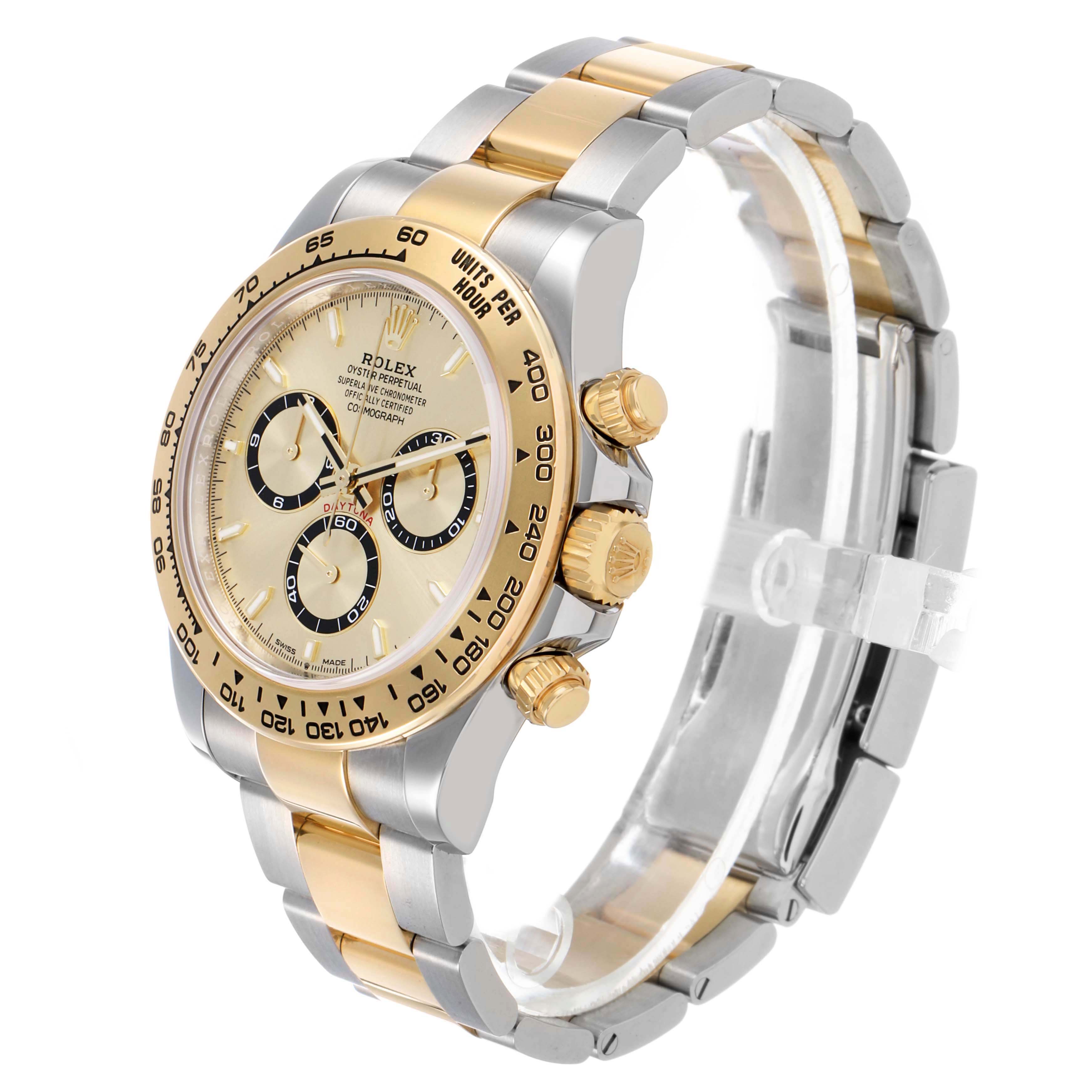 The Rolex Daytona 126503 Men's Steel and Gold (two tone) Champagne Dial watch is shown at an angled view, highlighting its dial, bezel, crown, and two-tone bracelet.