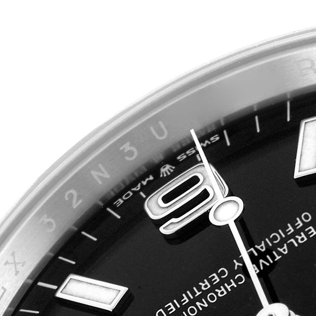 The image shows a close-up of the dial and bezel of the Rolex Explorer 124270 Men
s Stainless Steel Black Dial 124270 Men
s Stainless Steel Black Dial watch, highlighting the 9 o
clock numeral and part of the bezel markings.